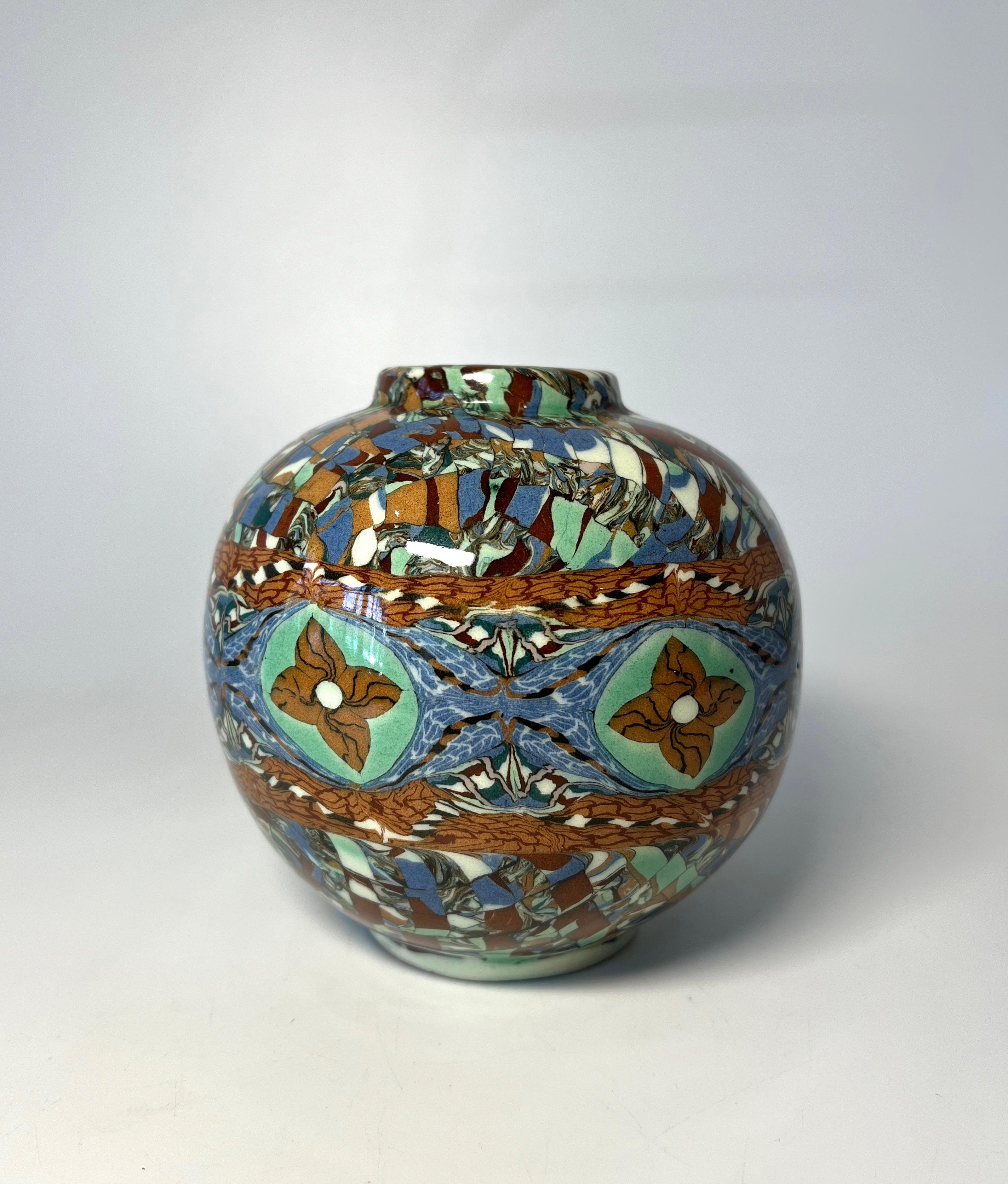 Jean Gerbino for Vallauris, France, ceramic glazed blue, green and terracotta banded mosaic ball vase 
Gerbino uses the Neriage technique to attain such intriguing patterns 
A generously sized piece
Circa 1960's
Signed Gerbino  to base
Height 5