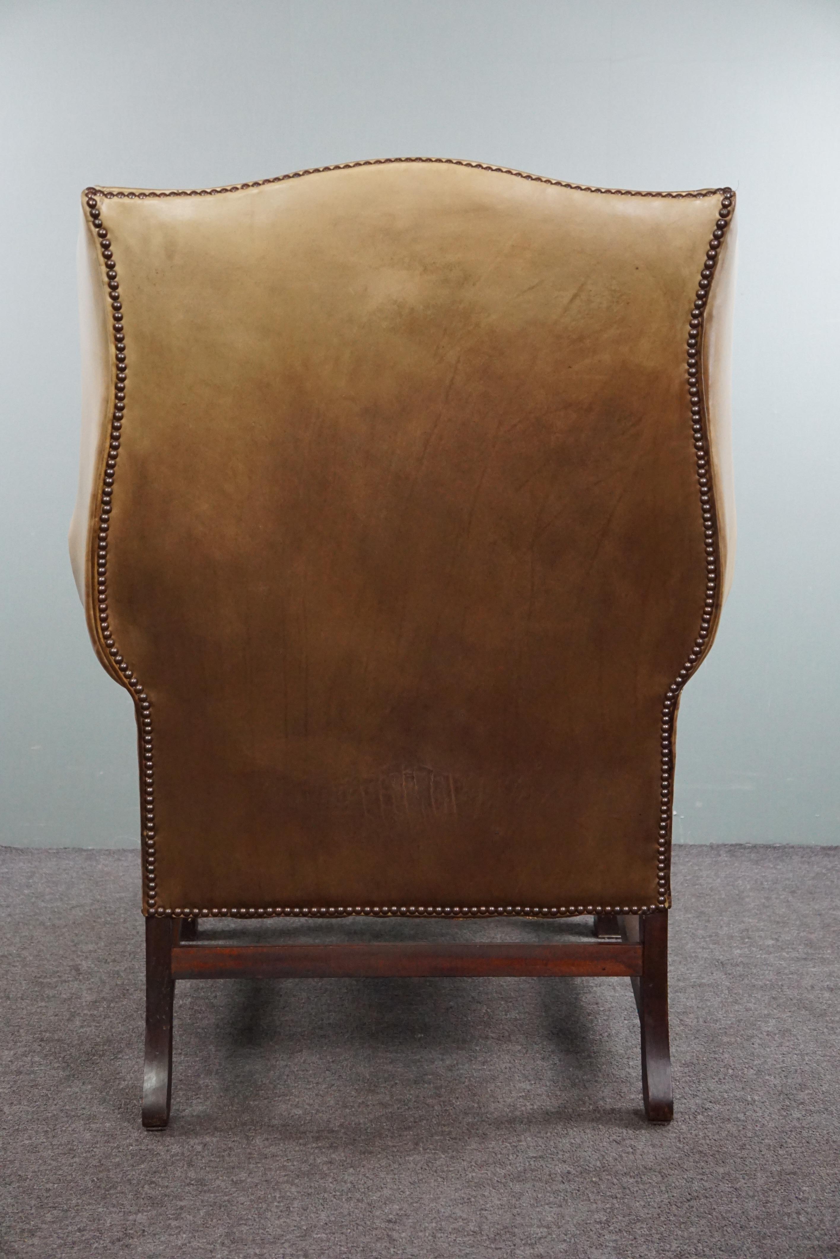 Late 20th Century Generous leather wingback armchair in very good condition.  For Sale