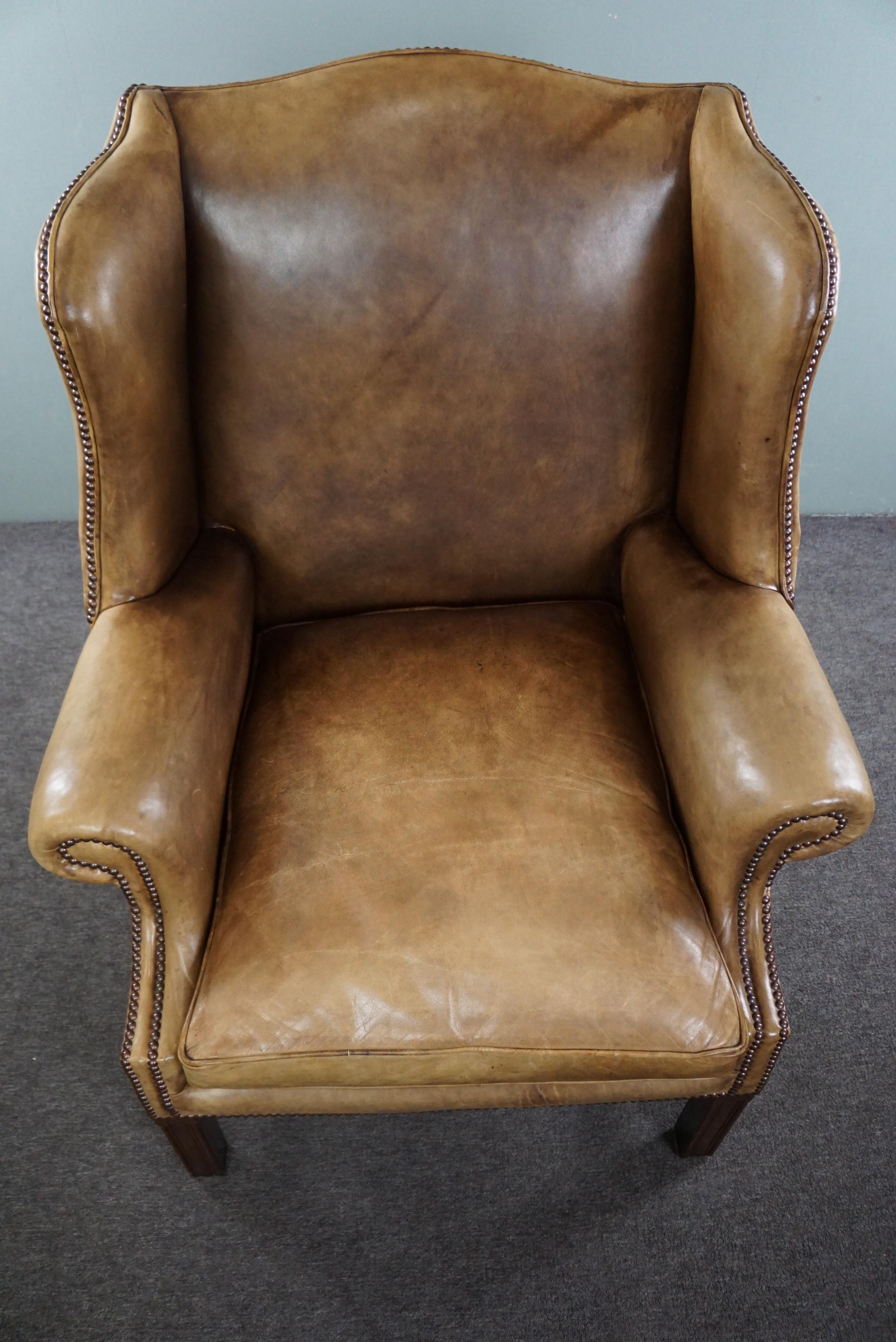 Generous leather wingback armchair in very good condition.  For Sale 1