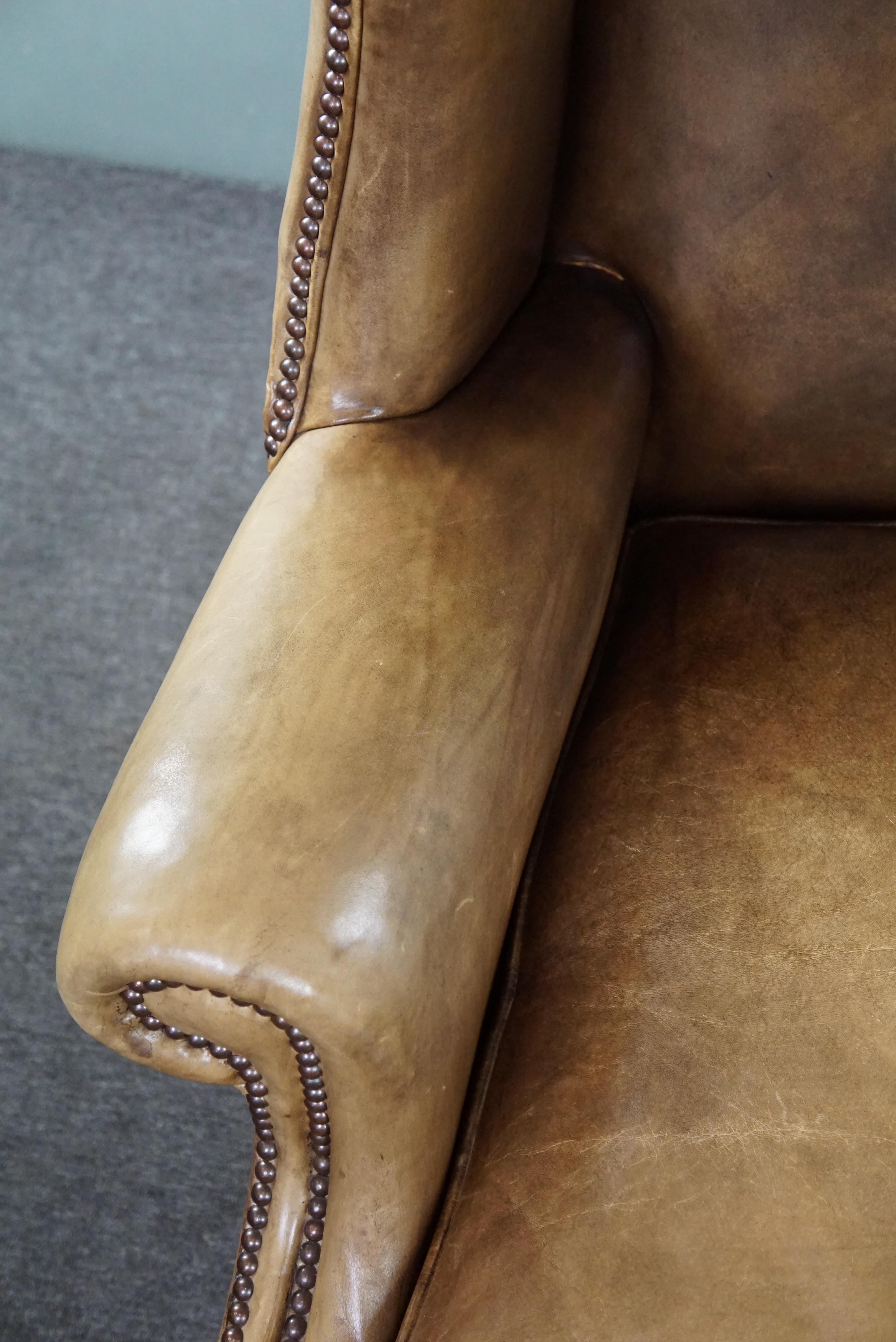 Generous leather wingback armchair in very good condition.  For Sale 2