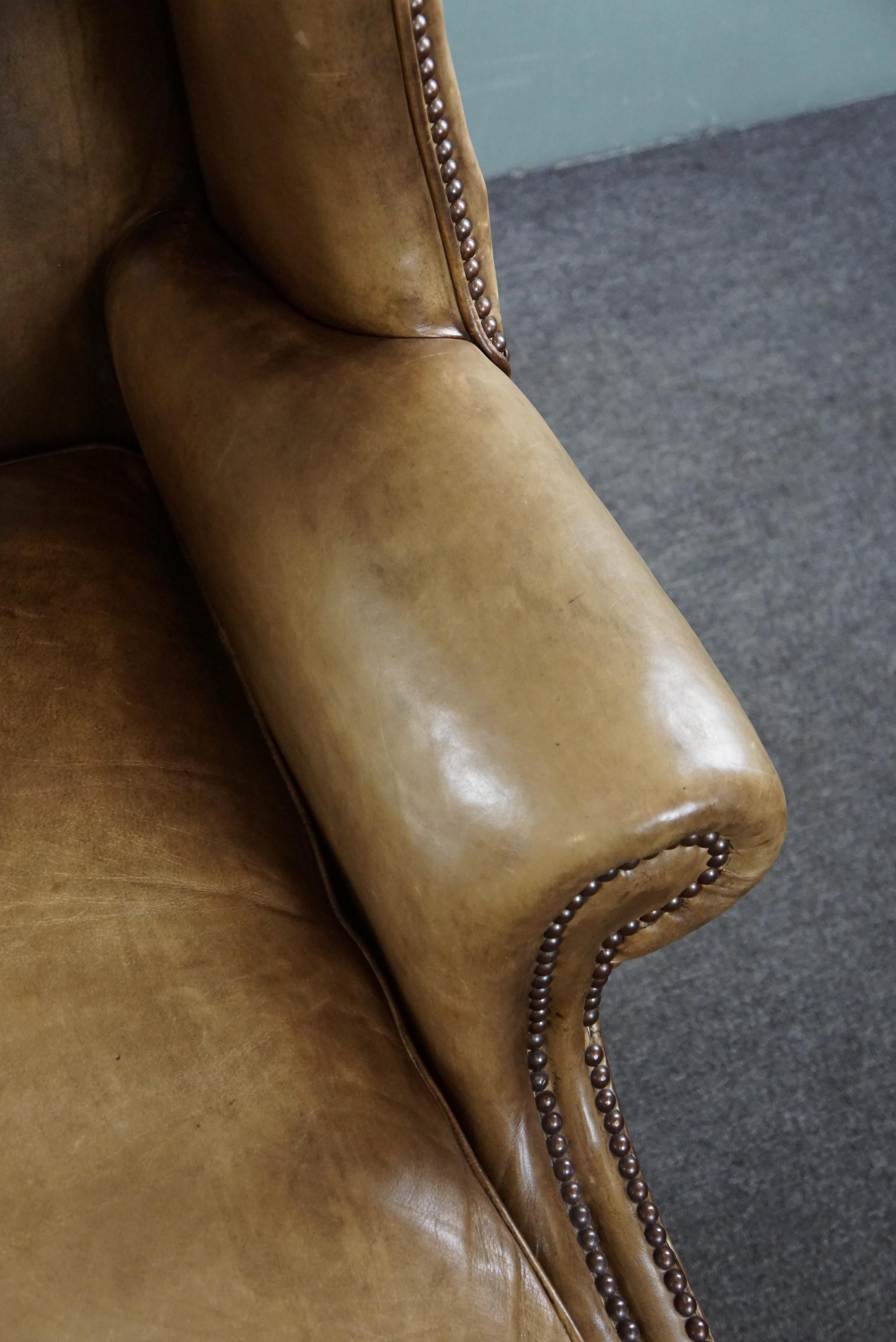 Generous leather wingback armchair in very good condition.  For Sale 3