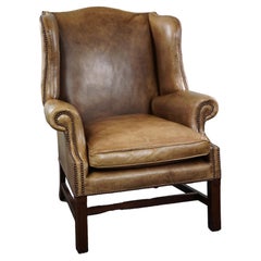 Generous leather wingback armchair in very good condition. 