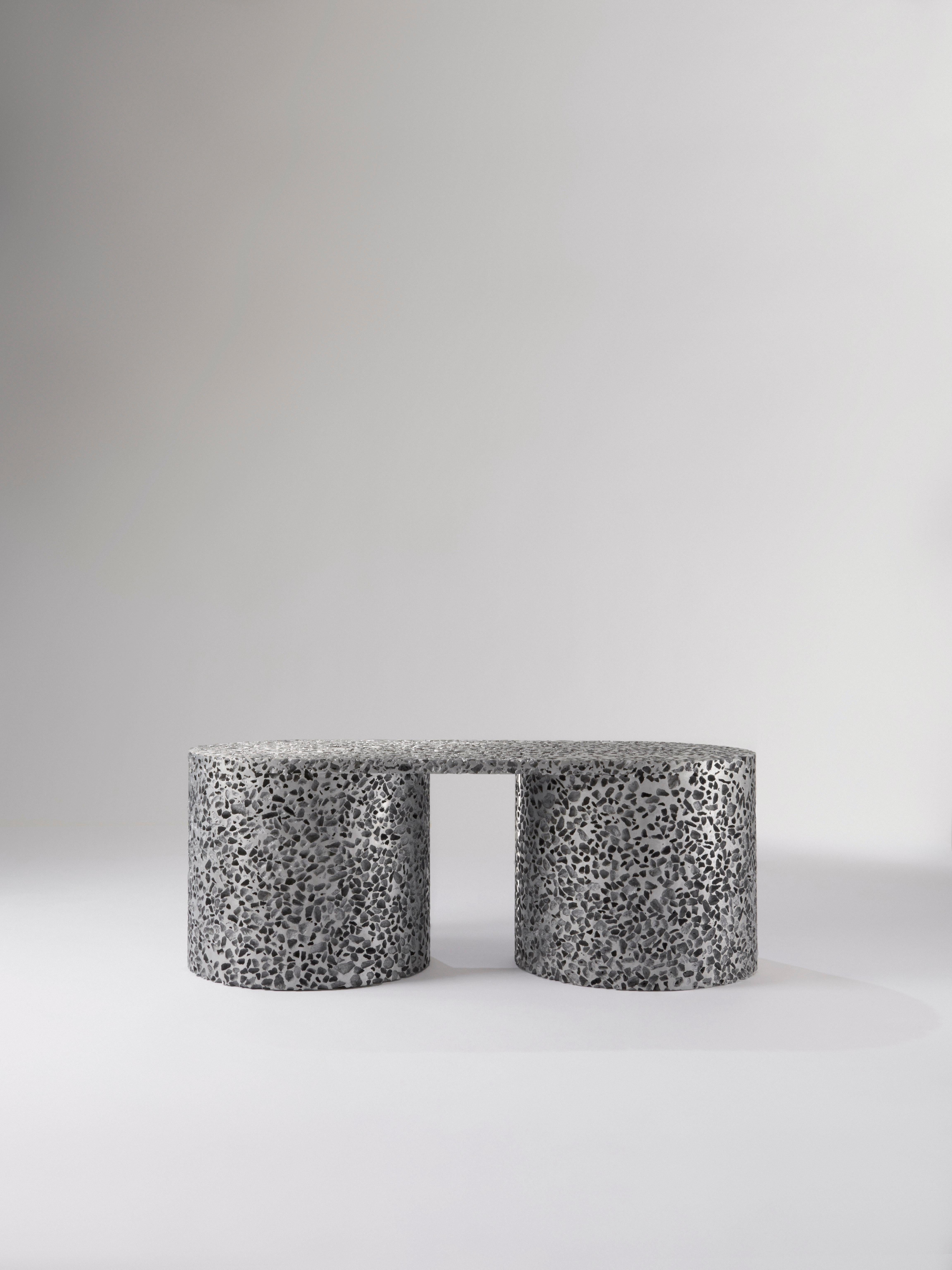 This coffee table is a functional piece of furniture, but it's also a diptych created from the microcosm of random structures of the open-cell aluminum foam and the severity and preciseness embedded in the industrial metal processes the humans have