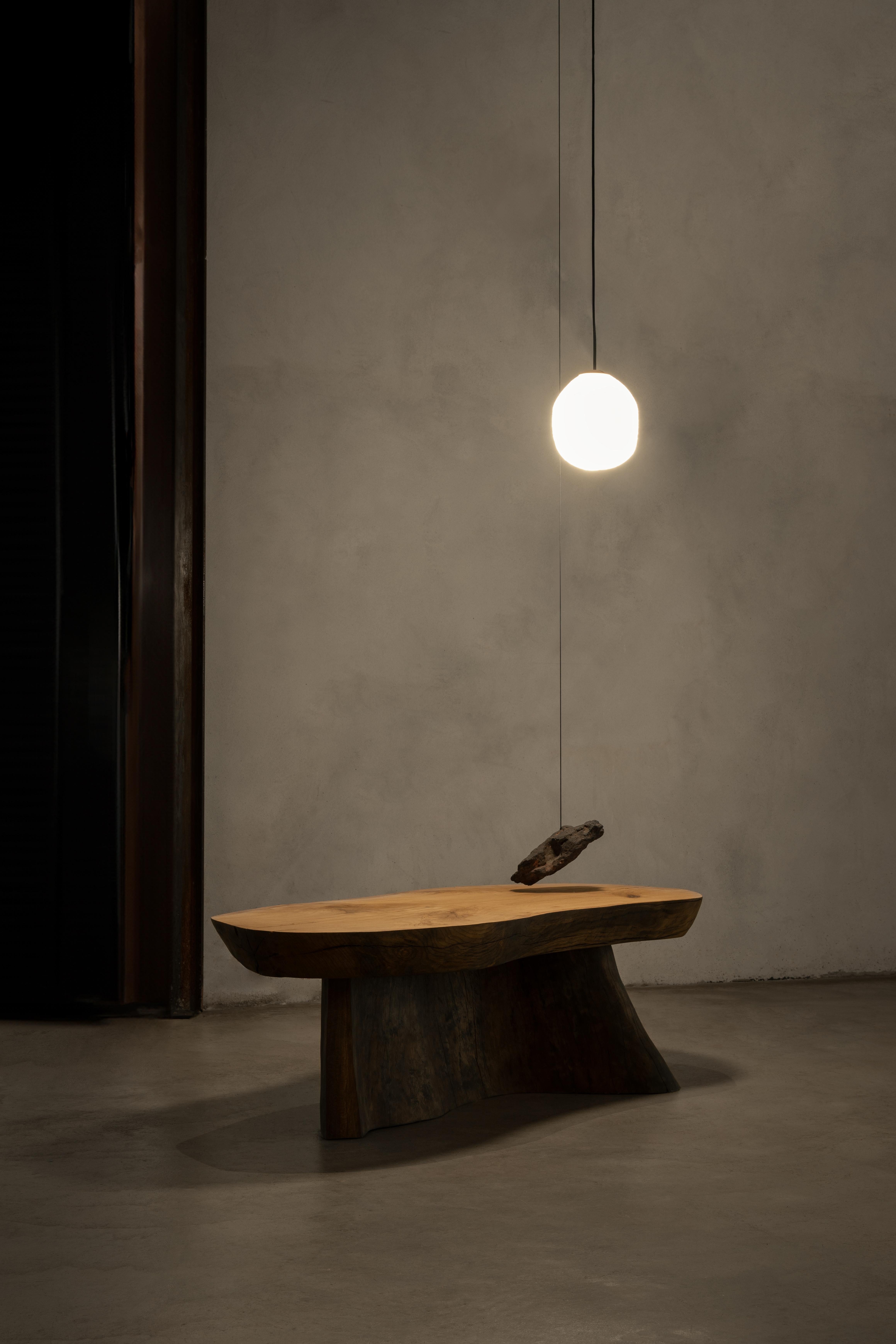 Genesis Coffee Table and Suspension Lamp by Jérôme Pereira 
Dimensions: D 50 x W 130 x H 40 cm
Materials: Oak, plane tree, blown glass, volcanic stone.

All our lamps can be wired according to each country. If sold to the USA it will be wired for