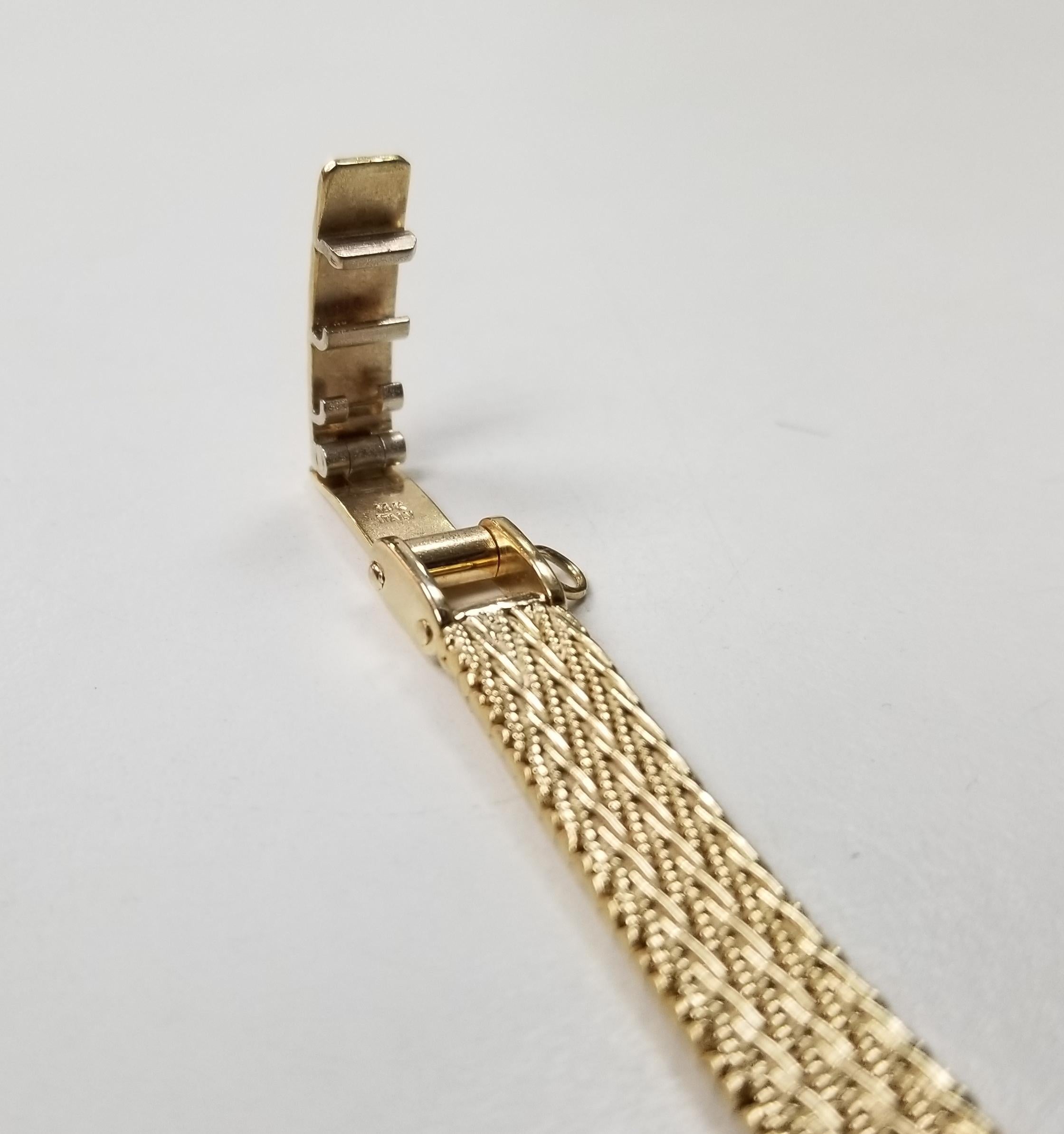 Contemporaneo Orologio Geneve in oro giallo 14 carati con diamante svizzero e cinturino a rete