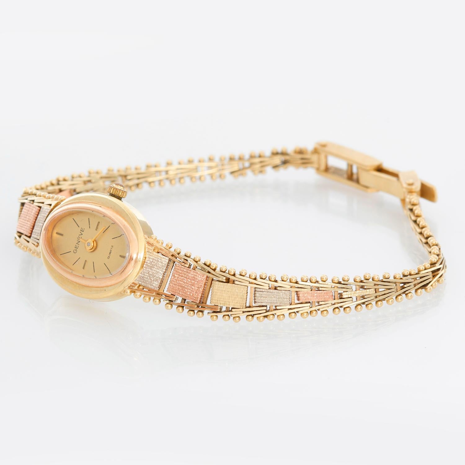 Geneve Ladies 14K Trigold Quartz Watch  - Quartz . 14K Yellow gold ( 16 mm ) . Champagne dial with stick hour markers . Rose gold, yellow gold and white gold bracelet ; will fit into a 7 inch wrist . Pre-owned with custom box .