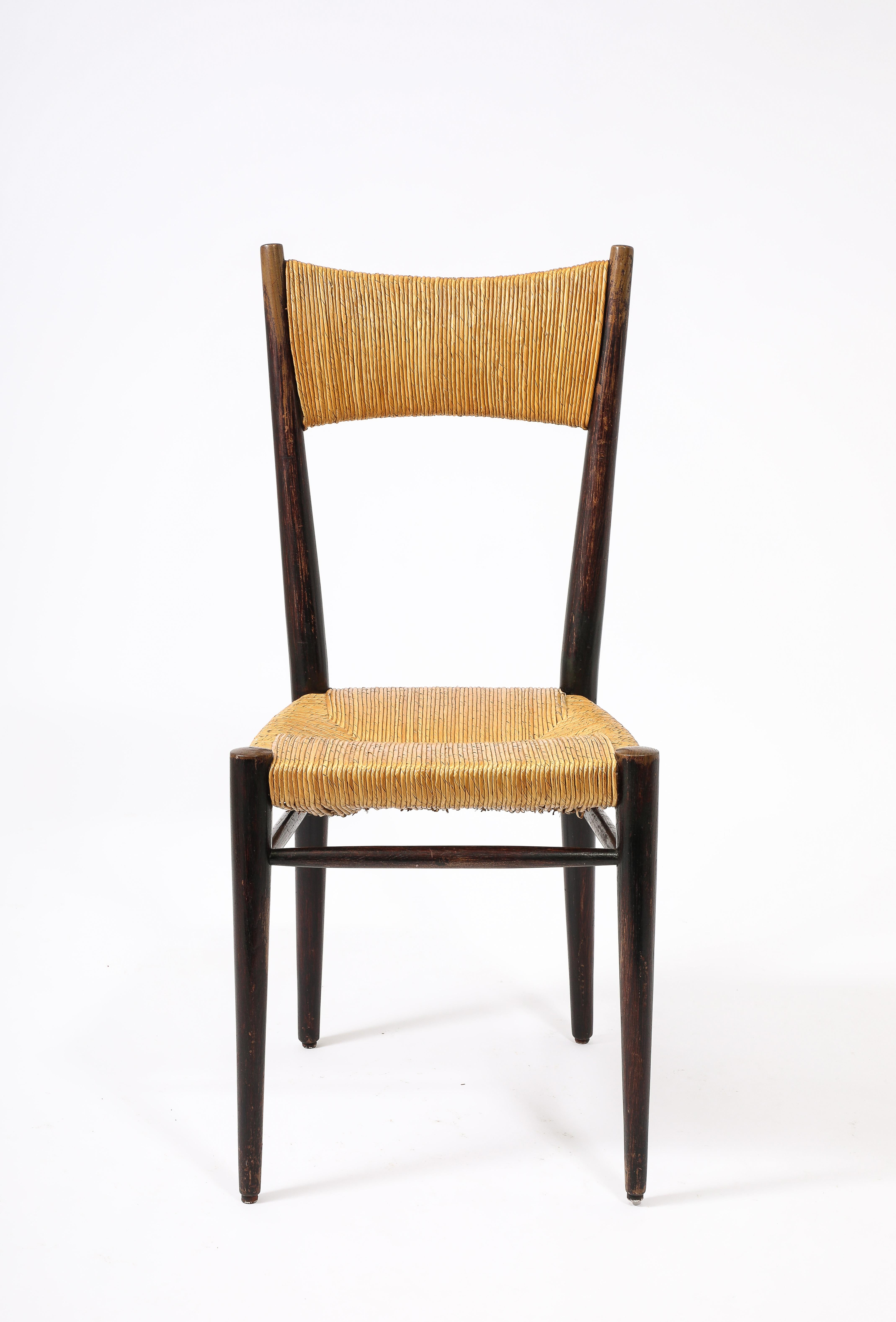 Four oak and rush dining chairs in original finish.