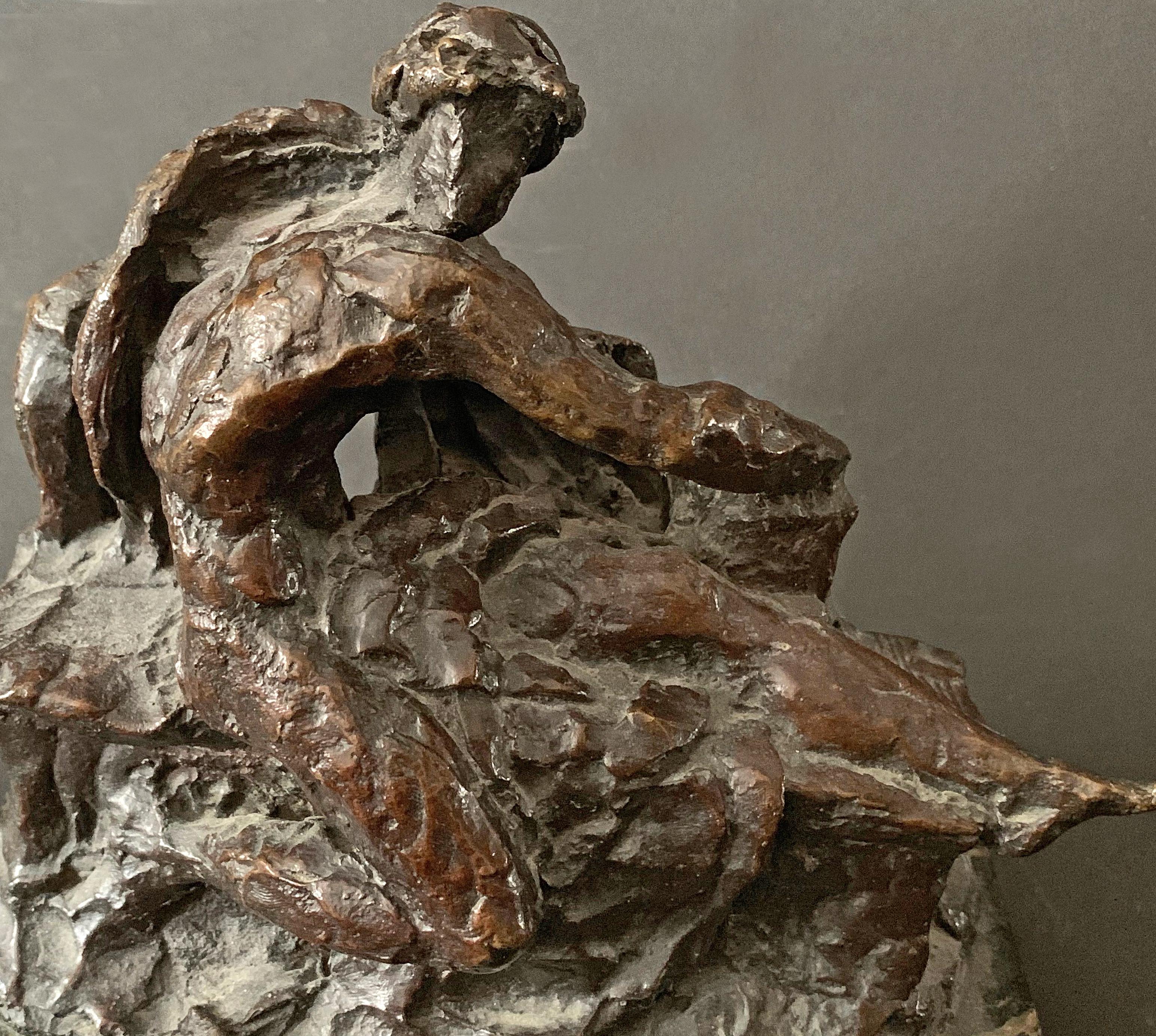 This rough-hewn bronze study was made for a highly-important funerary sculpture -- Génie gardant les secrets de la tombe (