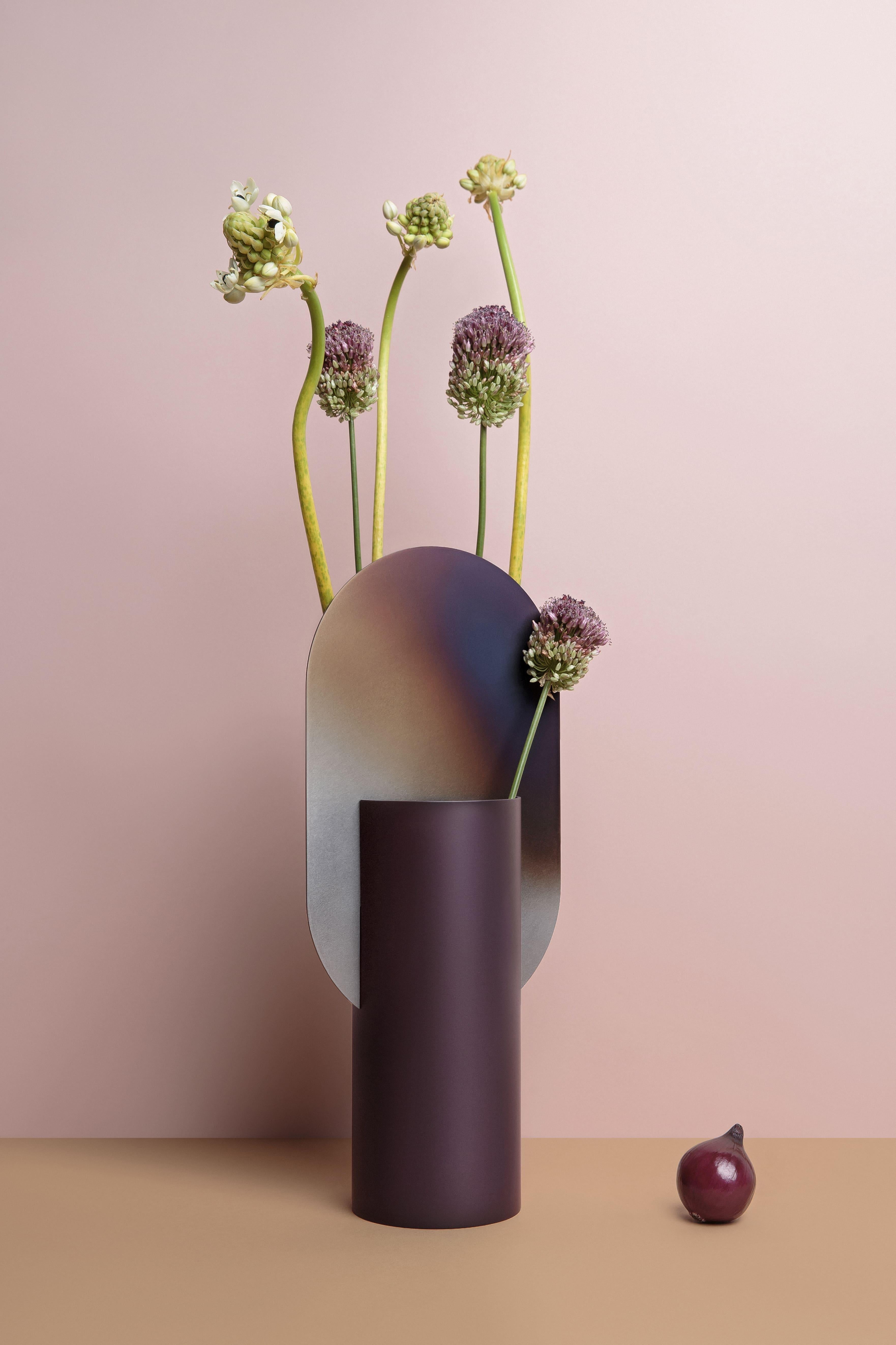 Genke vase by NOOM
Dimensions: H 38 cm x W 17 cm x D 10 cm
Materials: Burned steel, painted steel

NOOM is a young rapidly growing design company from Ukraine that produces lighting, decor and home accessories. 
We create timeless design