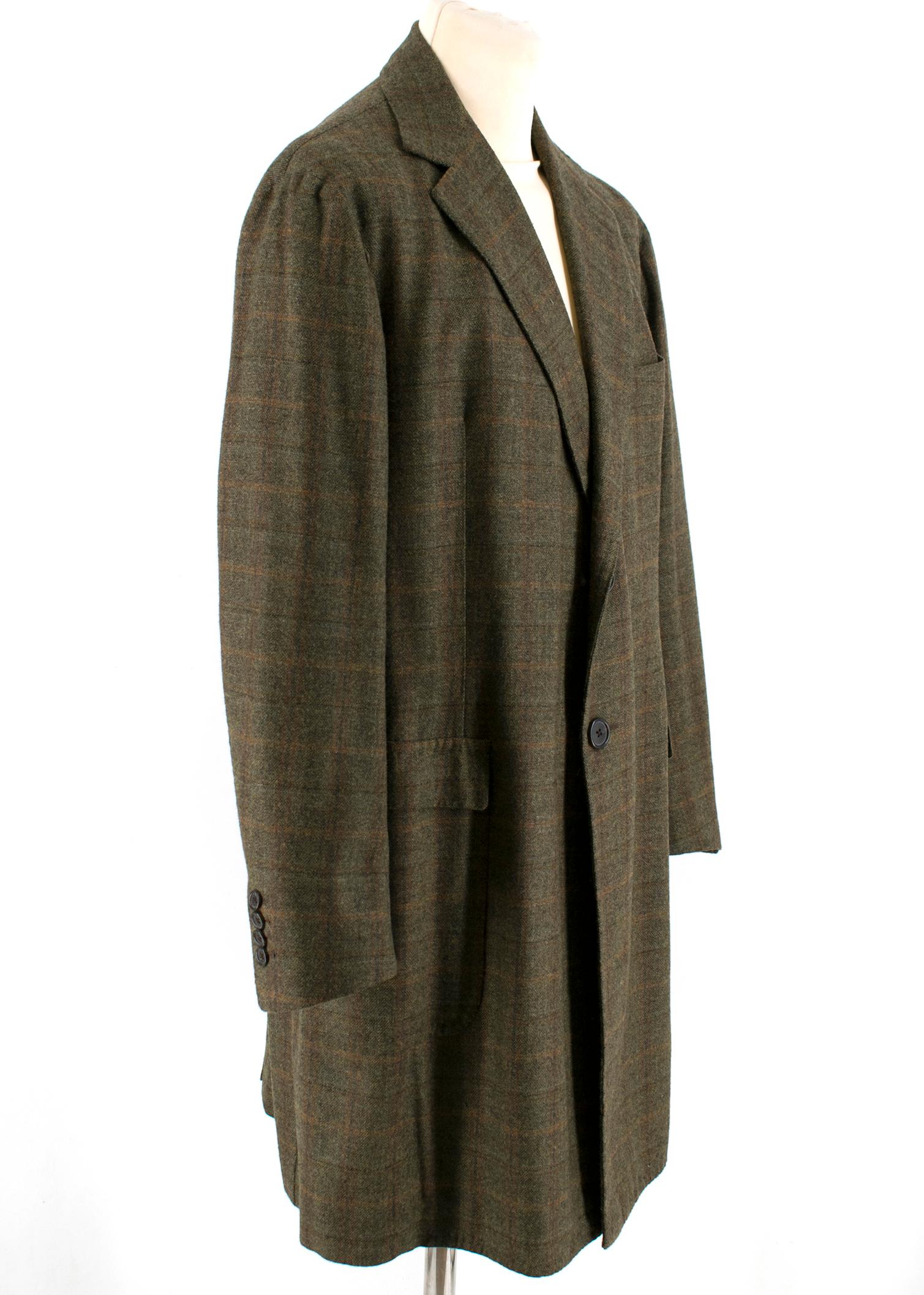 Gennaro Solito Bespoke Wool Green Checked Coat

- Moss Green, Blue, Orange and dark Orange checked woven coat
- Dark green button closure and dark brown cuff
- One chest pocket
- Single breasted coat

Please note, these items are pre-owned and may