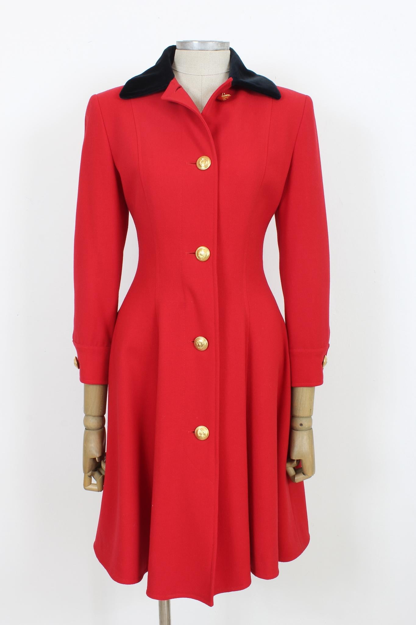 This Genny red wool vintage classic flared dress is a timeless 90s piece perfect for any evening event. Crafted in warm wool and featuring a luxurious velvet collar, this flared dress boasts a timeless classic look and button gold details. Let your