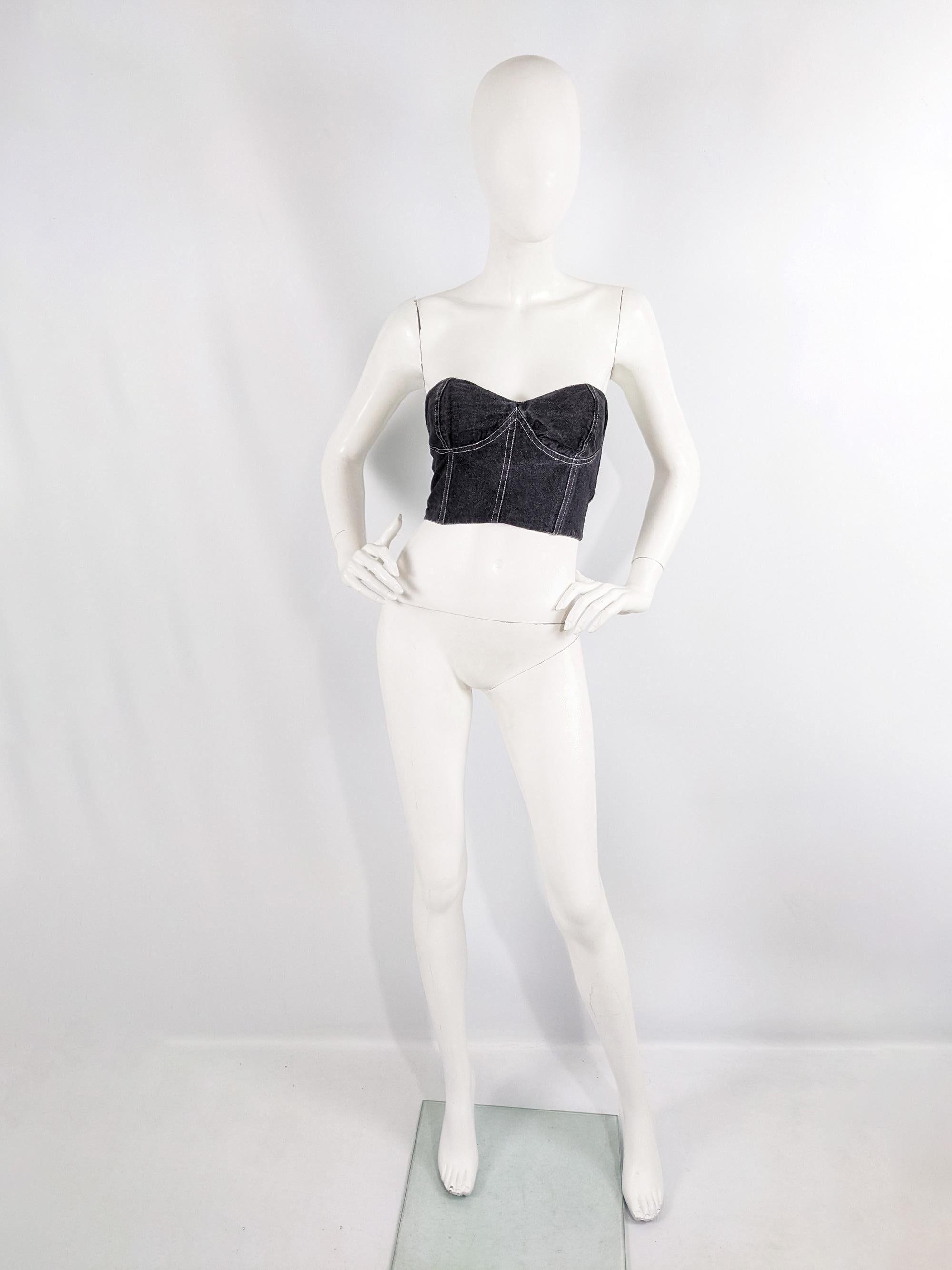 A cute vintage womens denim boob tube from the 80s by luxury Italian fashion label, Genny, who Gianni Versace designed for before starting his own label. Made in Italy from a black denim with white top stitching and a sweetheart neckline.

Size: