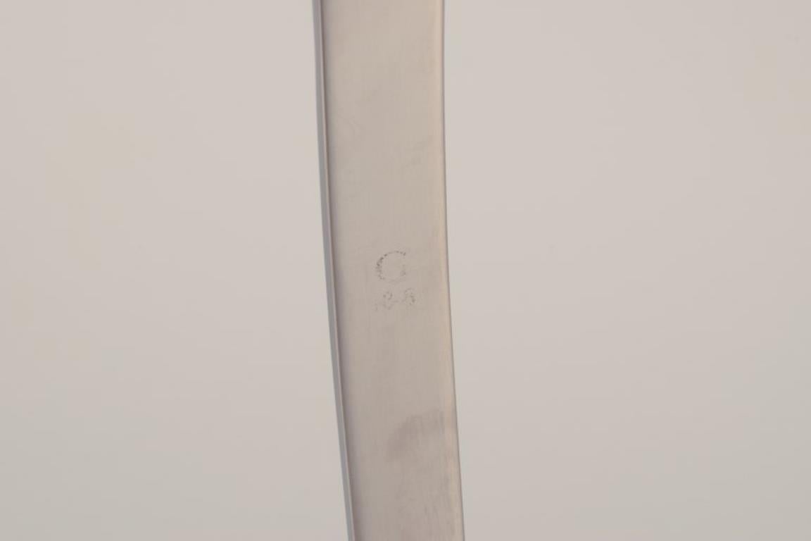 20th Century Gense, Sweden. Two serving forks in stainless steel. For Sale
