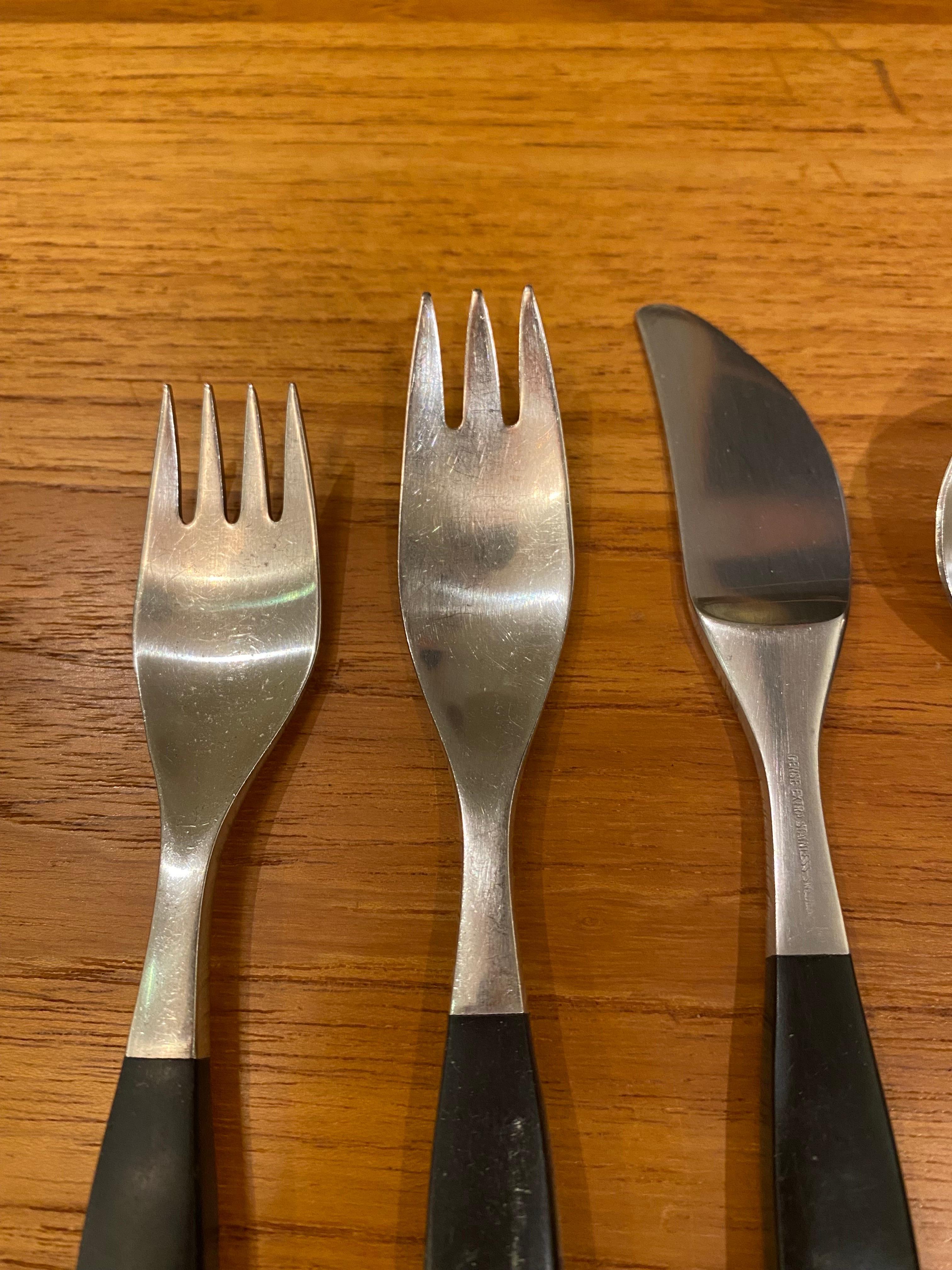Gense Stainless Steel, complete Service for 12 plus 4 Serving pieces. Handles are a black Resin or Bakelite material that has the look of ebony. Overall in good shape, shows typical wear and use.