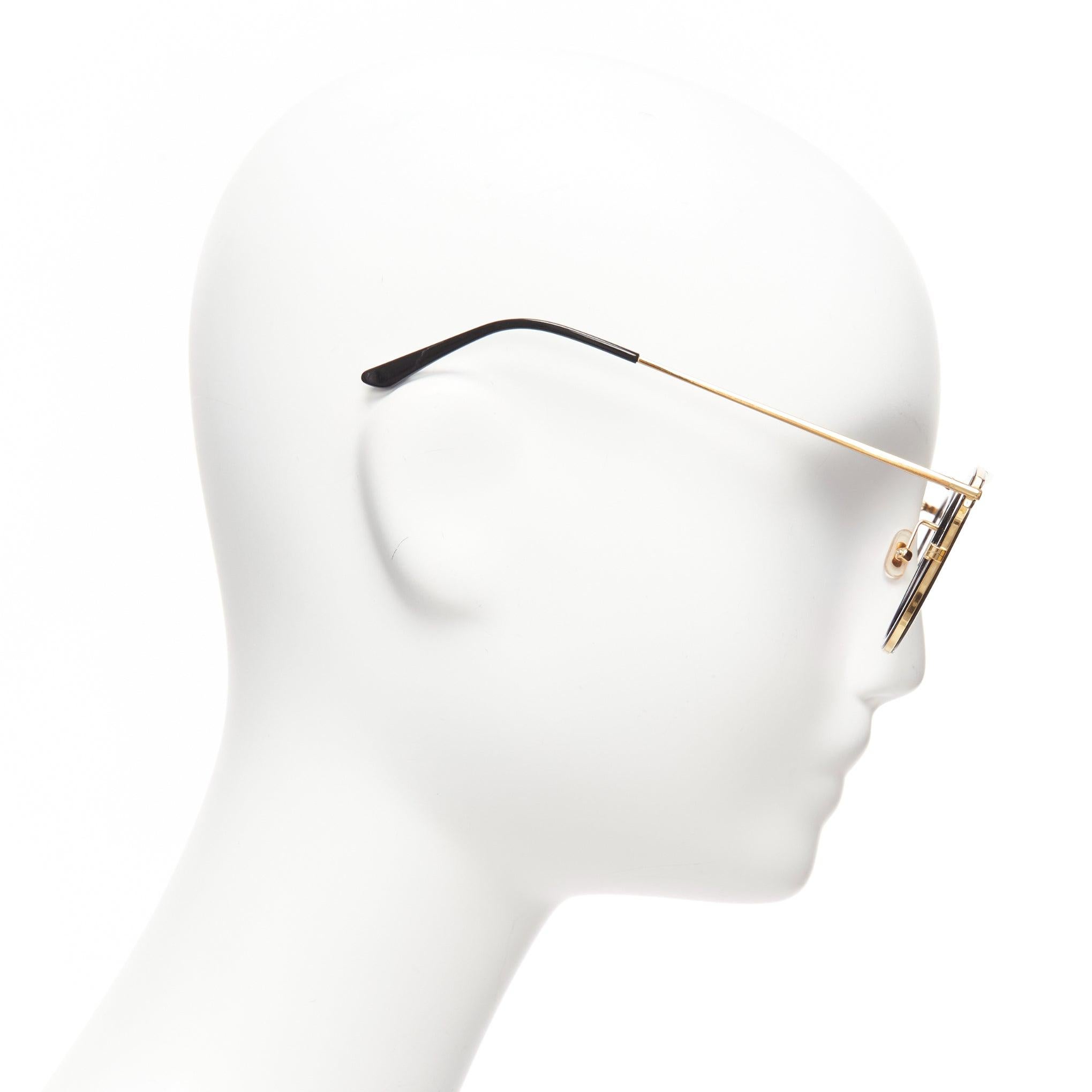 Women's GENTLE MONSTER Moon Cuts orange marble reflective lens sunglasses For Sale