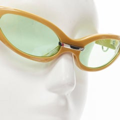 GENTLE MONSTER Lunettes de soleil futuristes à œil de chat vert moutarde en verre