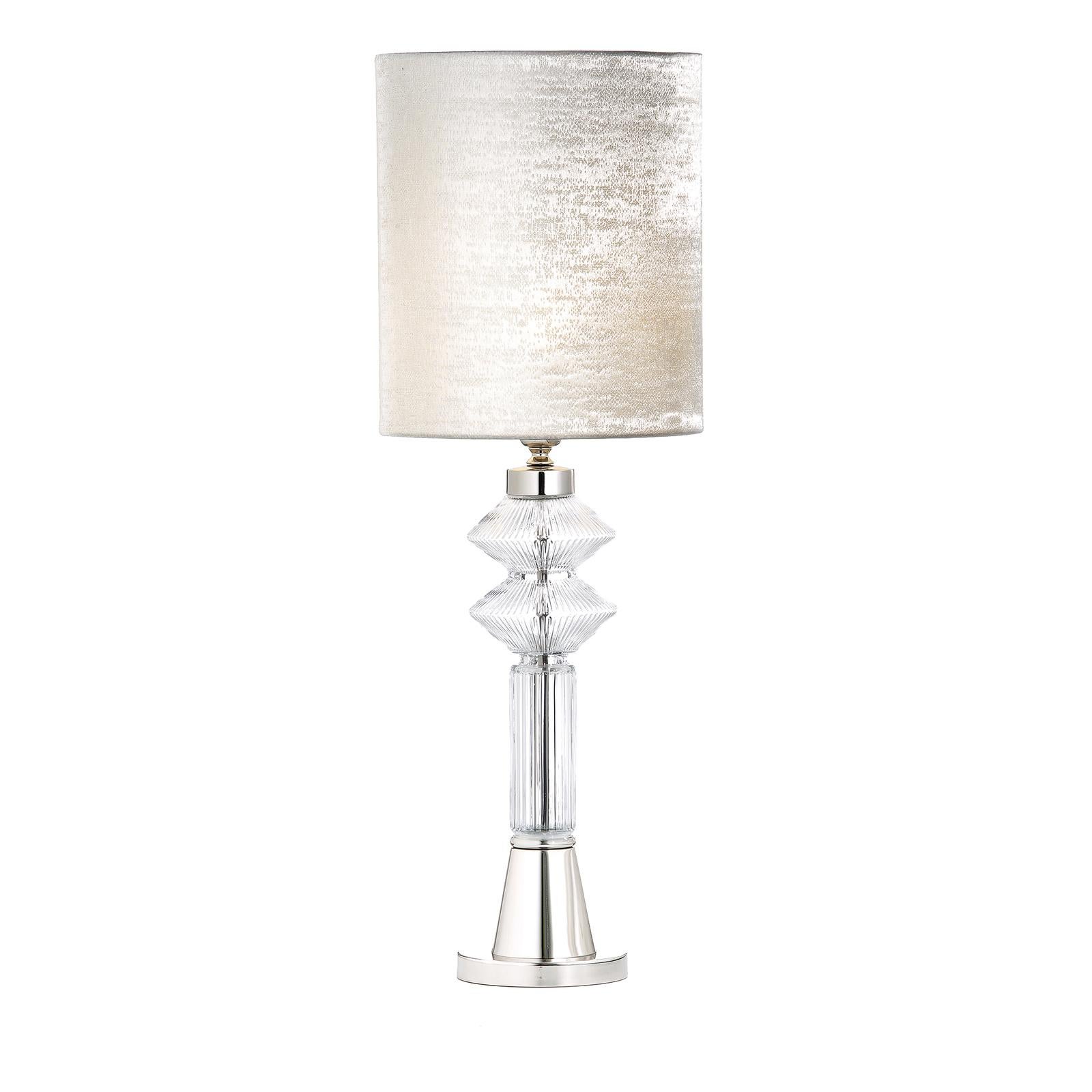 A delicate balance of rigorous geometries and delicate textures creates this unique and charming table lamp that will infuse both a modern or classic home with understated sophistication. The metal structure has a polished nickel finish and features