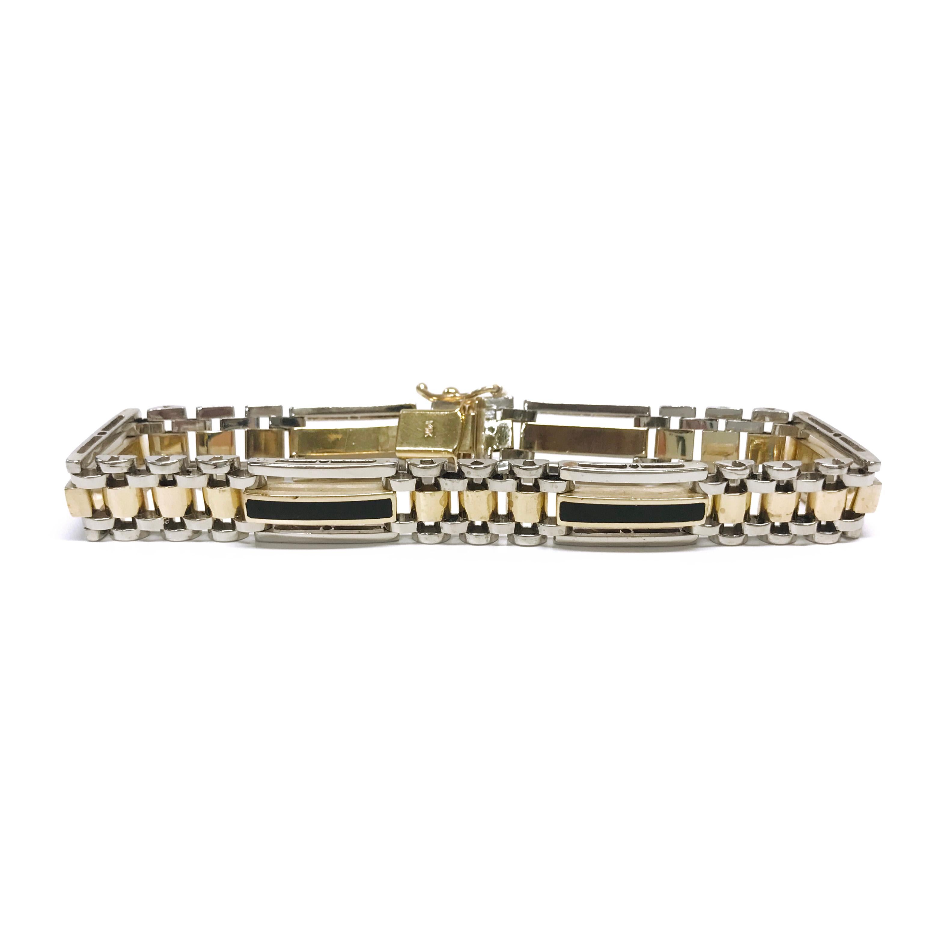 Gentleman's 14 Karat Gold Onyx Bracelet. The bracelet features five horizontal bar links with black Onyx inlay and five sets of three links in between.  The entire bracelet has a shiny smooth finish for a sleek sophisticated look. The bracelet is