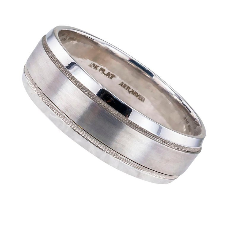 Gentleman’s 7 mm 18 karat white gold and platinum wedding band size 11 ½ created by Artcarved a reputable American manufacturer of quality wedding bands.  

Specifications

Metal is 18 karat white gold and platinum.

Weight is 10.0 grams.

Ring Size