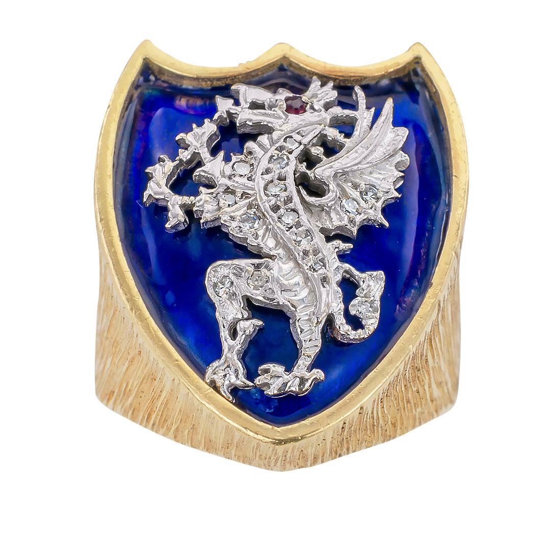 Gentleman’s blue enamel and diamond dragon with ruby eye and yellow gold crest ring with English hallmarks, ring size 10 ½. 

Specifications:

Diamonds: fourteen single cut diamonds totaling approximately 0.10 carat.

Other Gemstones: one round