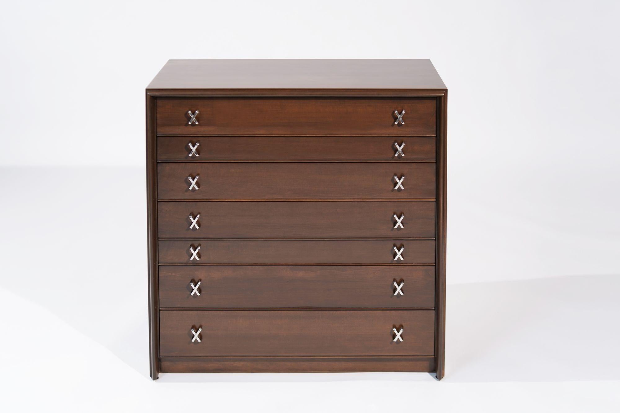 The Gentleman's Chest by Paul Frankl, a tribute to mid-century elegance from the 1950s, meticulously restored to perfection by Stamford Modern. Crafted from exquisite maple, the chest has been transformed with a warm walnut tone, enhancing its
