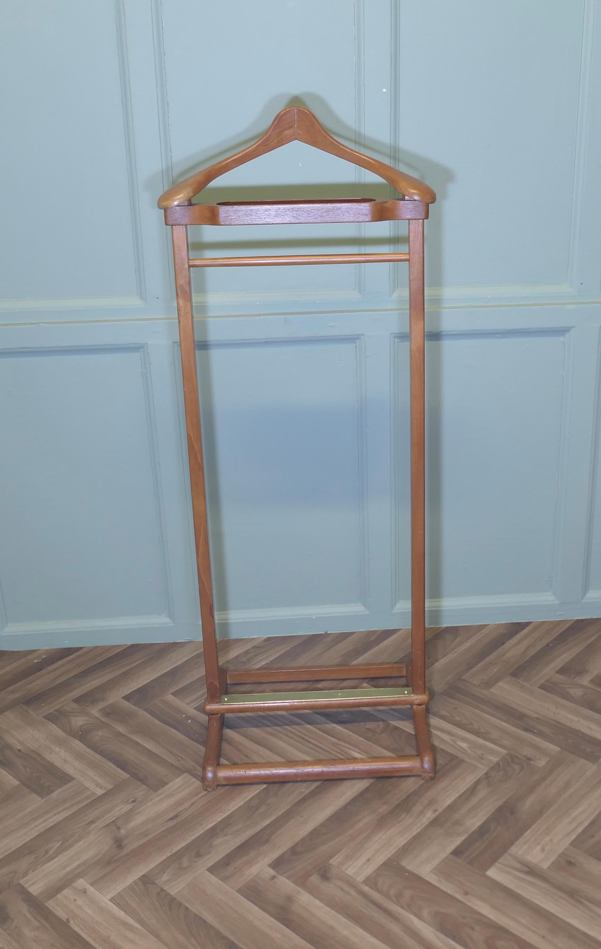 Gentleman’s Floor Standing Valet or Suit Hanger 

 A very useful piece, the Valet or clothes stand is made in teak, it will accommodate jacket and trousers, but it would do just as well for your jeans and a jacket overnight or would make an