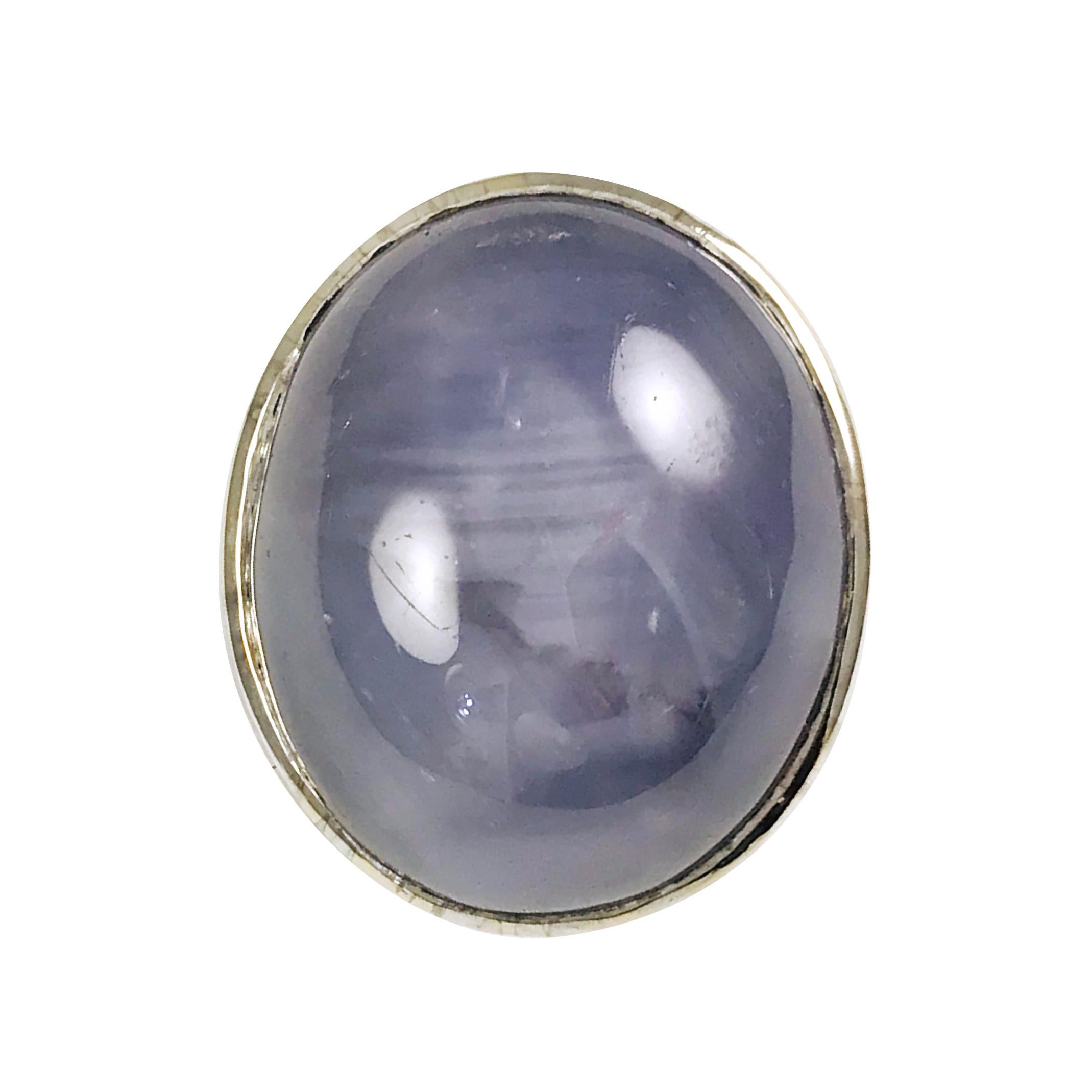 Gentleman's 18k White Gold Star Sapphire Ring. AIG Certified, appraisal #000719115072. The ring size is 9.

Electrically tested 18k white gold gents cast star sapphire ring. The condition is good. 

The bezel-set blue star sapphire is supported by