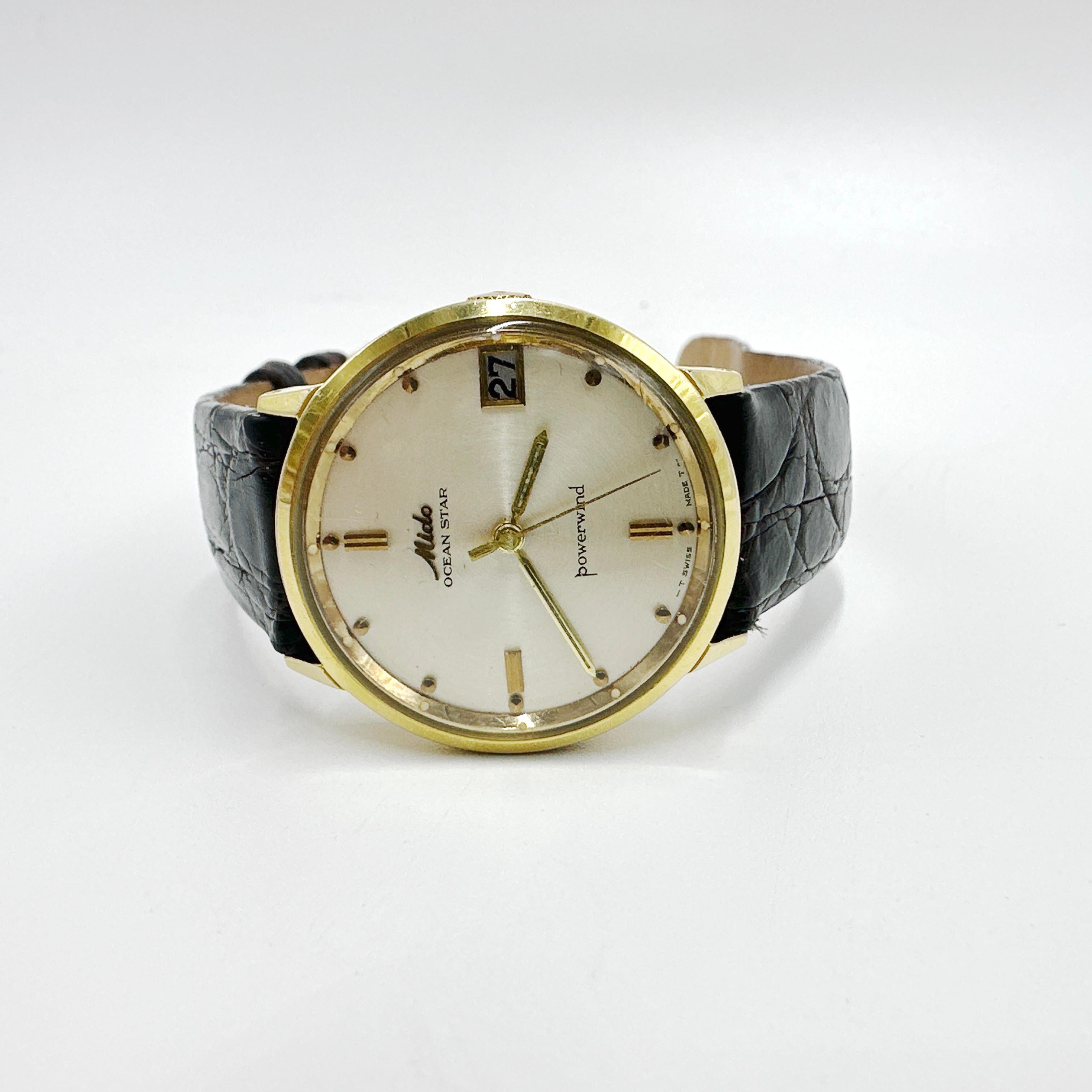 Here is a handsome Gentlemen's 1960s MIDO Ocean Star Powerwind 14k Gold Plated Vintage Swiss Automatic Watch. This automatic Swiss watch has a date feature and is in overall good condition and keeping good time. Strap and buckle are a new