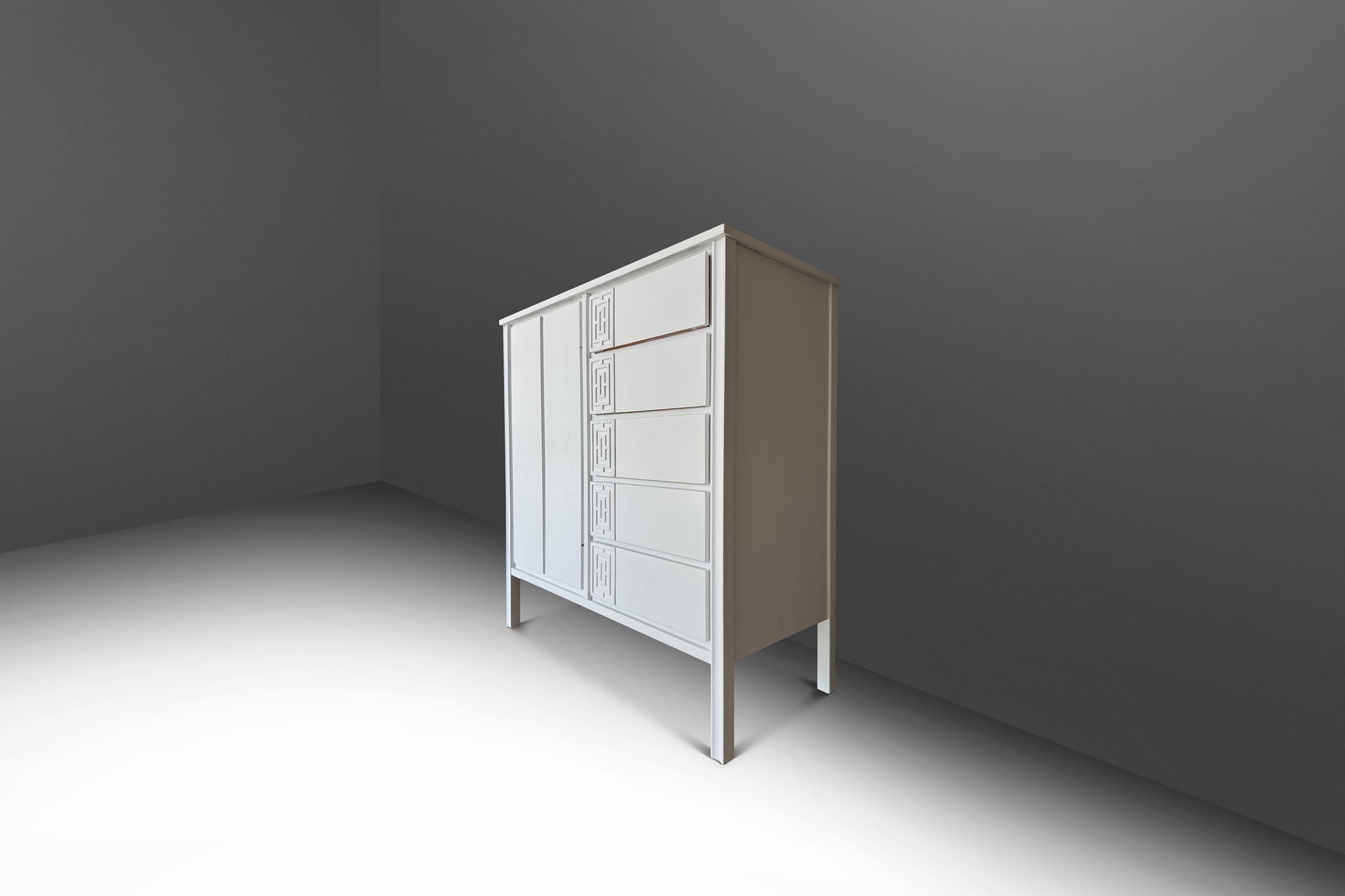 This sophisticated Mid-Century Modern gentleman’s dresser by Dixie, crafted in the USA during the 1960s, offers a perfect blend of style and functionality. The tall boy dresser features a crisp white painted exterior that highlights its clean lines,