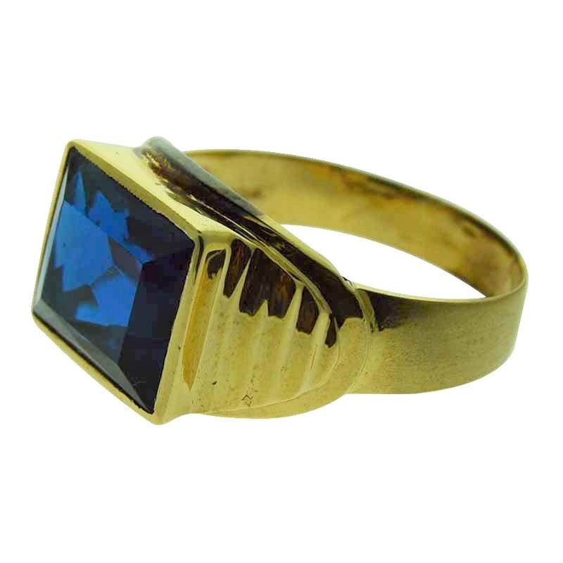 A striking, Art Deco Gents ring in fluted 10Kt Solid Yellow Gold set with a brilliant cobalt, rectangular Synthetic Sapphire.  Size 11.0. This ring is New Old Stock, basically unworn. A classic Men's ring of the period, weighing 4.4 grams. Circa