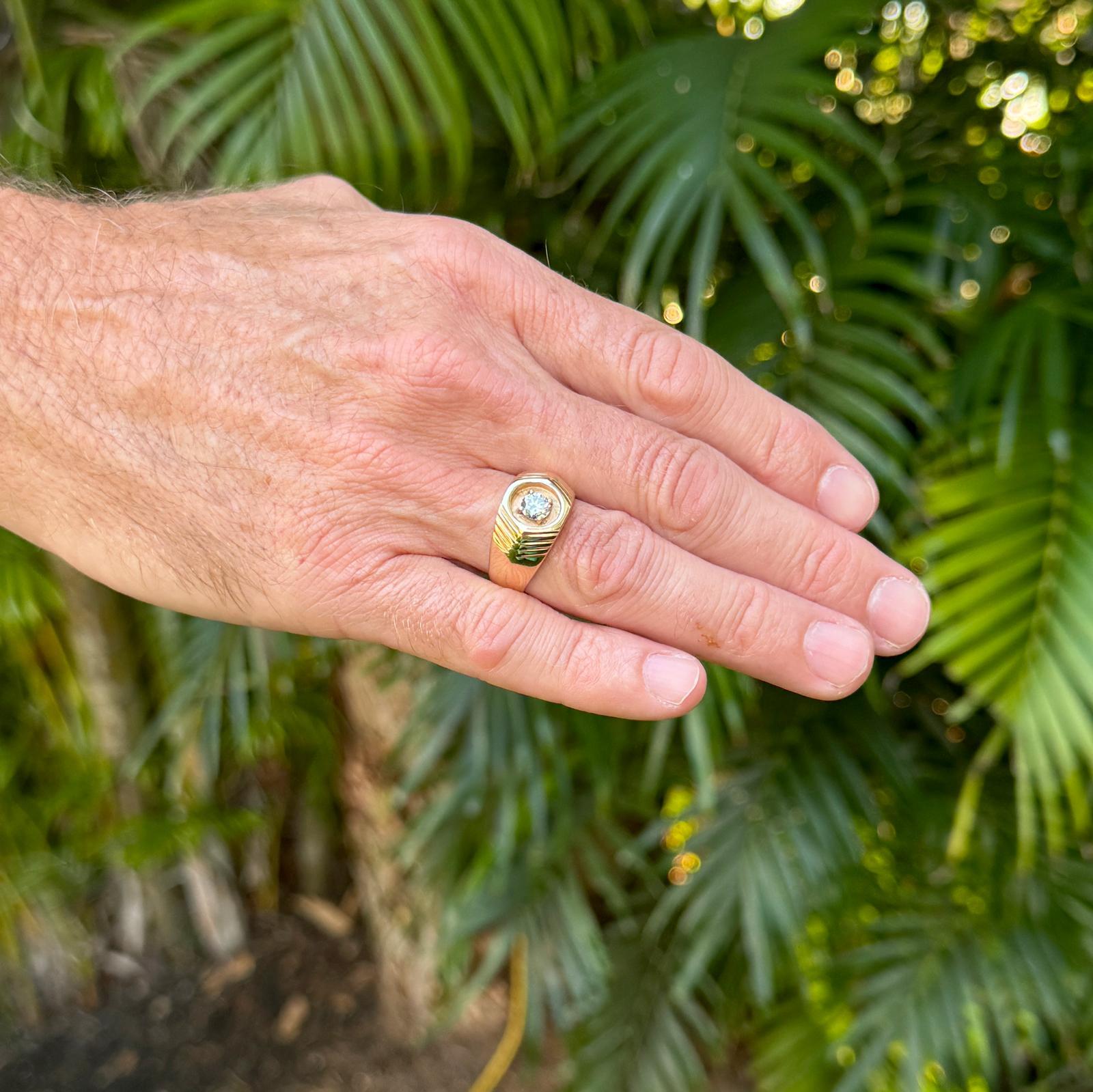 Gents diamond soitaire vintage ring handcrafted in 14 karat yellow gold. The .50 carat round brilliant cut diamond is the centerpiece of the ring, prong set in the carved gold mounting. The ring measures 12mm in width and is currently size 9 (can be