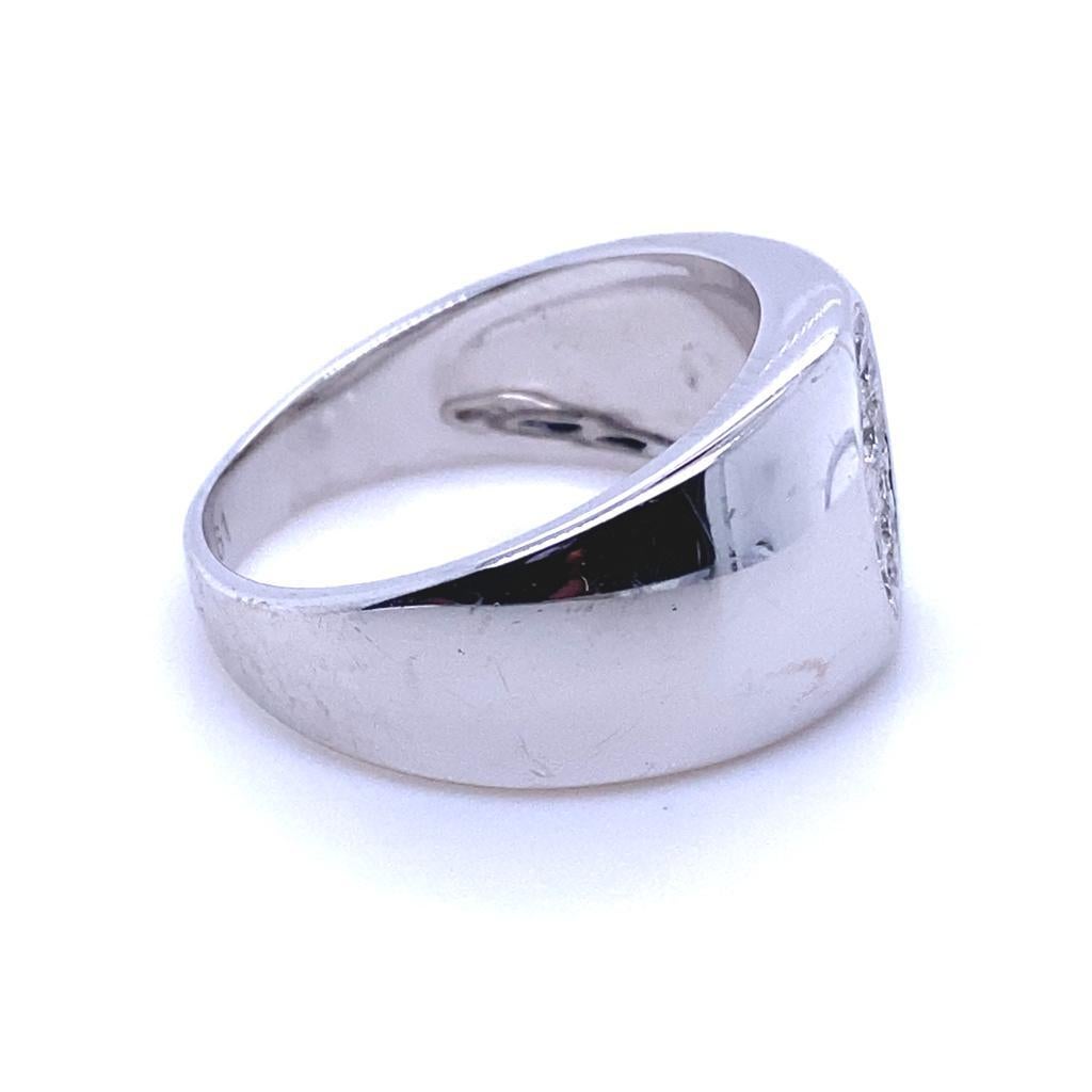 A Dior Homme diamond ring in 18 karat white gold.

This contemporary gents ring by Dior is a timeless piece that combines elegance with modernity. Its plain polished gently curved streamlined design features a concave oval with pavé set round