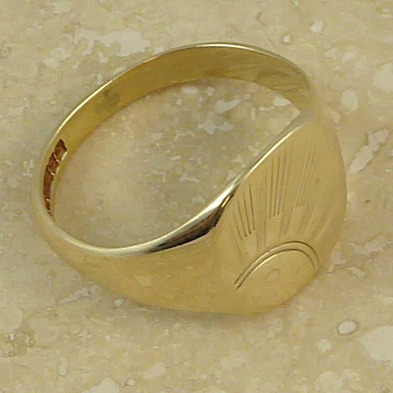A vintage gold signet ring for men dated 1987 and hallmarked at the Birmingham Assay Office in the England.  The top of the ring is a cushion shape, approx. 0.5