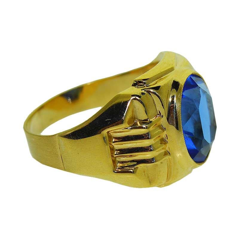 Styled with a Bold, Geometric pattern typical in Art Deco Design, this Gent's 10Kt Solid Yellow Gold Ring features a bright and  brilliant Cornflower Blue glass stone.  The oval stone is secured by a bezel with light milgrain edge detail. The ring