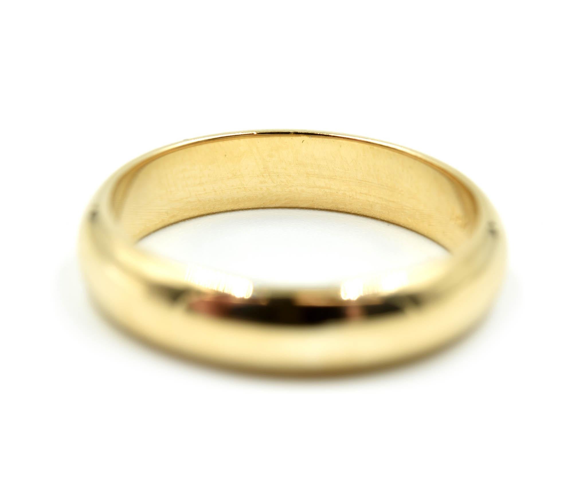 Designer: custom design
Material: 14k yellow gold
Dimensions: band is 5mm wide
Ring Size: 9 ½ 
Weight: 6.20 grams
