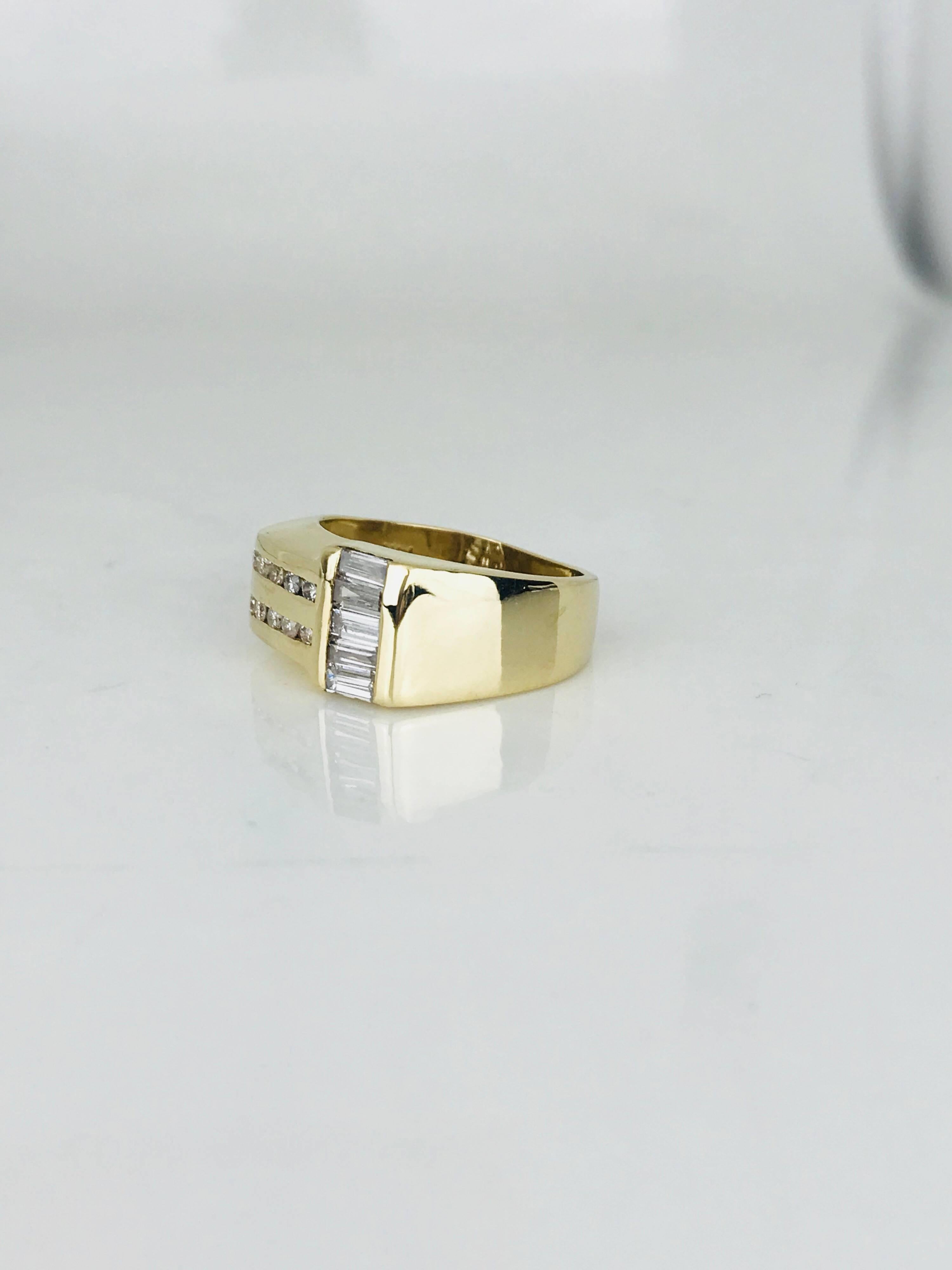 Contemporary, gents diamond band ring 10.28 millimeters wide. The diamond width of the ring measures 18.40 millimeters. 
(12) round cut diamonds having a total weight of approximately .36 carat. Quality are SI1-2 and color is H
(5) baguette cut