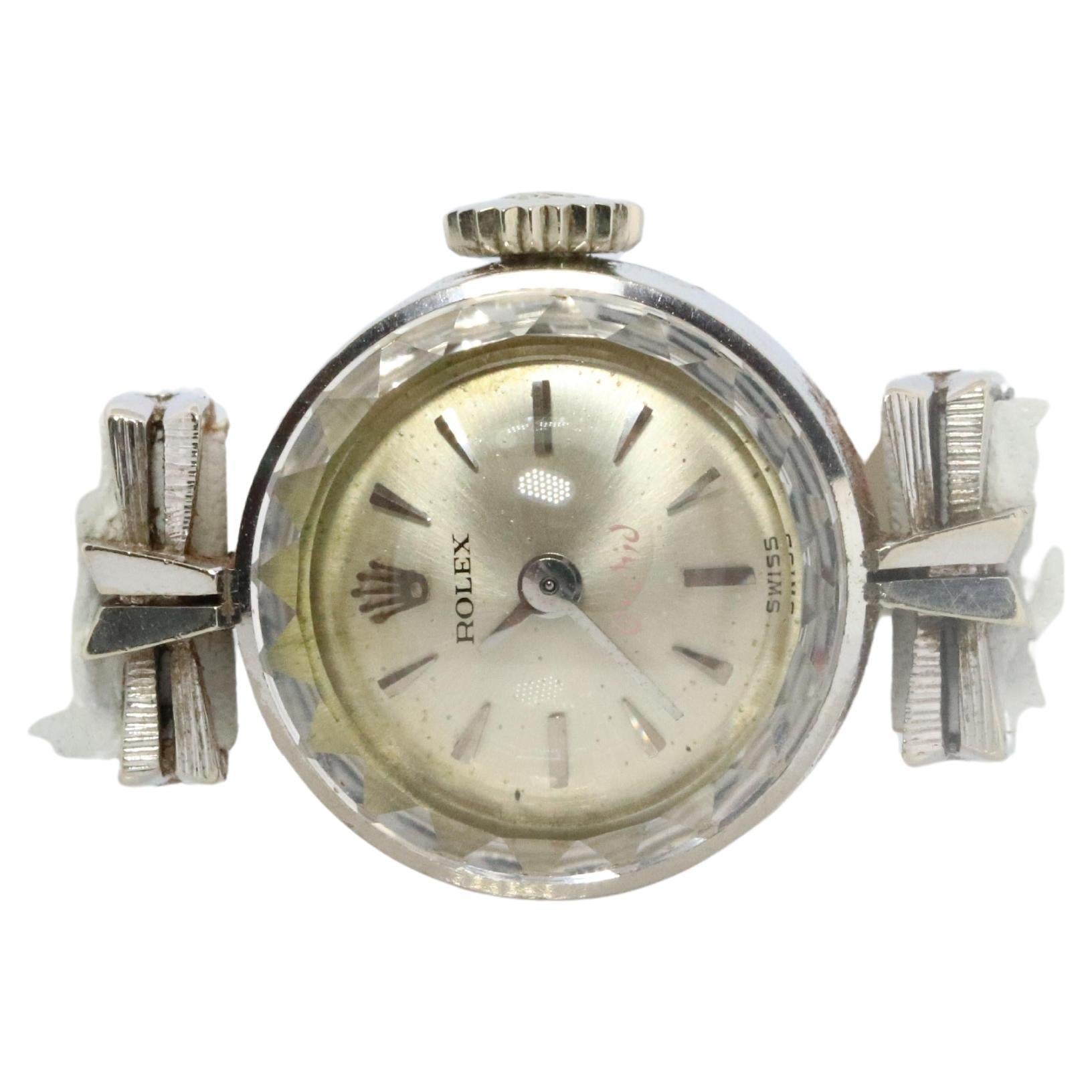 18k White Gold Rolex Orchid Ladies mechanical Movement Wristwatch. Circa 1967

Dainty 16mm Case.

Rolex 1400 Movement Ref. 2247.

Beautiful Watch. Manual Windup mechanism. 

Case is 18k 750 White gold
Brand new 8mm White Leather band.
16mm