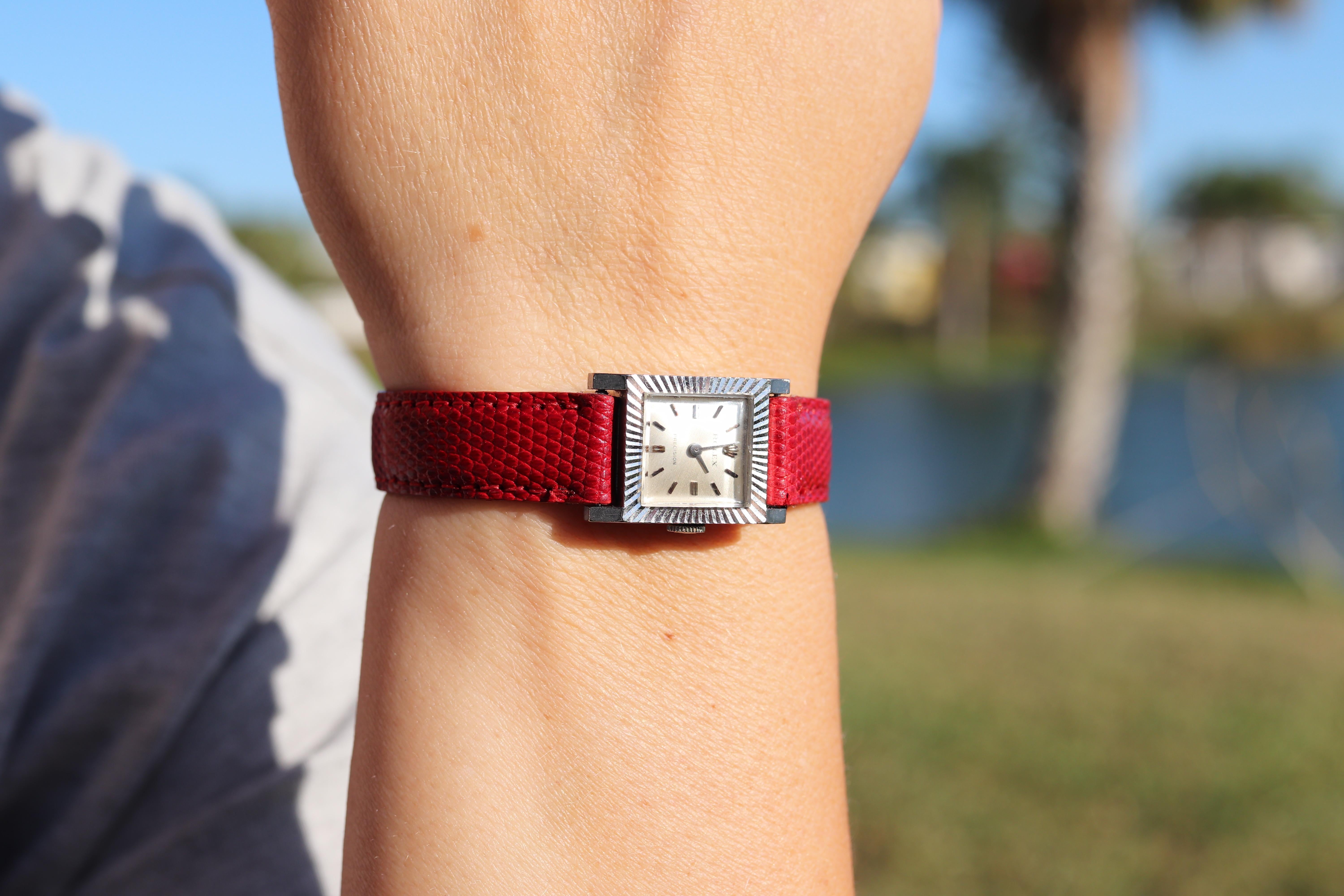 18k White Gold Rolex Precision Ladies mechanical Movement Wristwatch. Circa 1967s

Dainty 16mm by 23mm Case.

Rolex 1400 Movement Ref. 2157.

Beautiful Watch. Manual Windup mechanism. 

Case is 18k 750 White gold
Brand new Red Leather