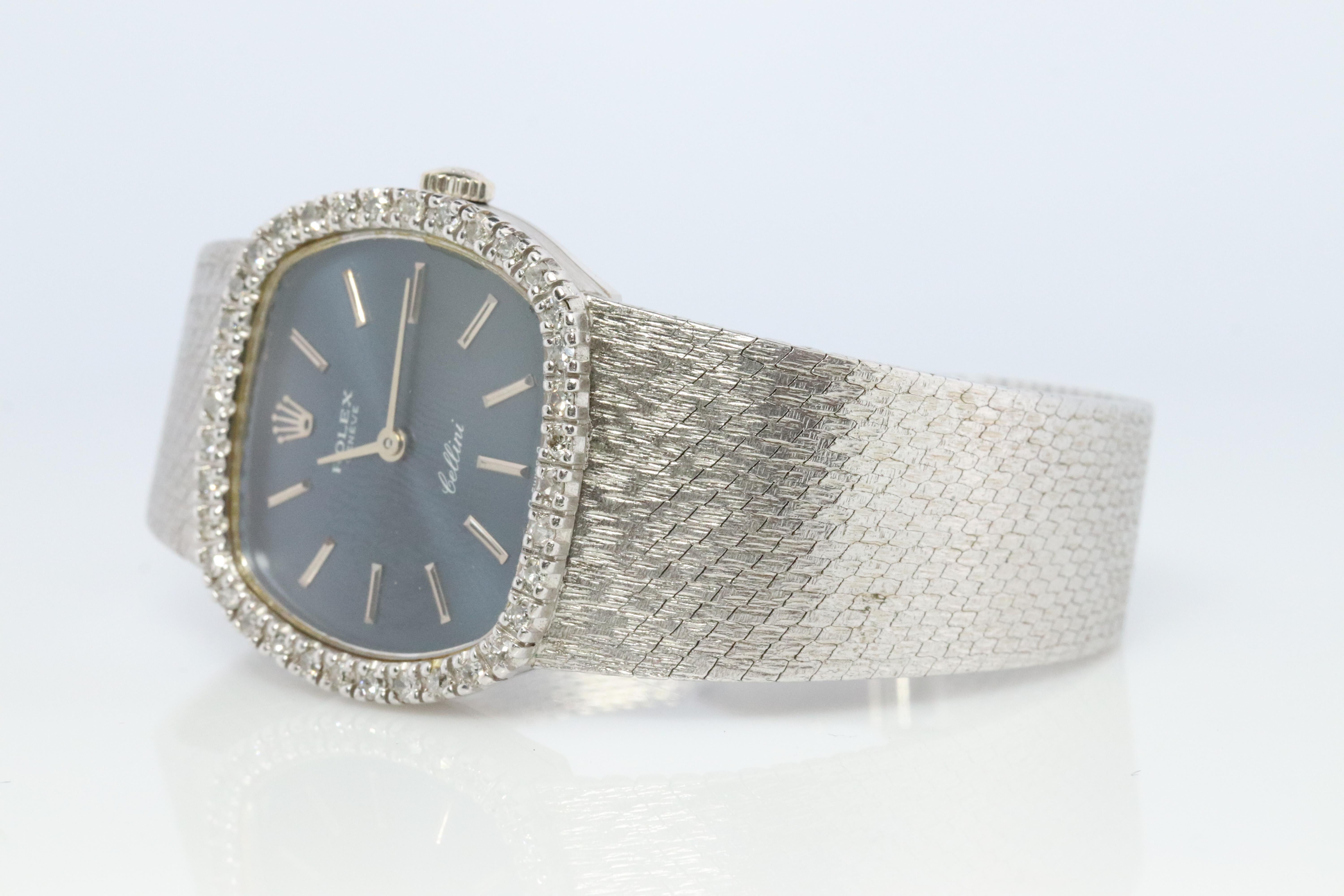 18k Rolex Cellini Watch with attached Milanese Bracelet (Stainless Steel)

Full Diamond Bezel with Navy blue dial.

1600 Caliber Rolex Movement Ref. 3801.
Circa 1973

Case Is 18k White Gold. Bracelet is Stainless Steel.

Beautiful Watch. Manual