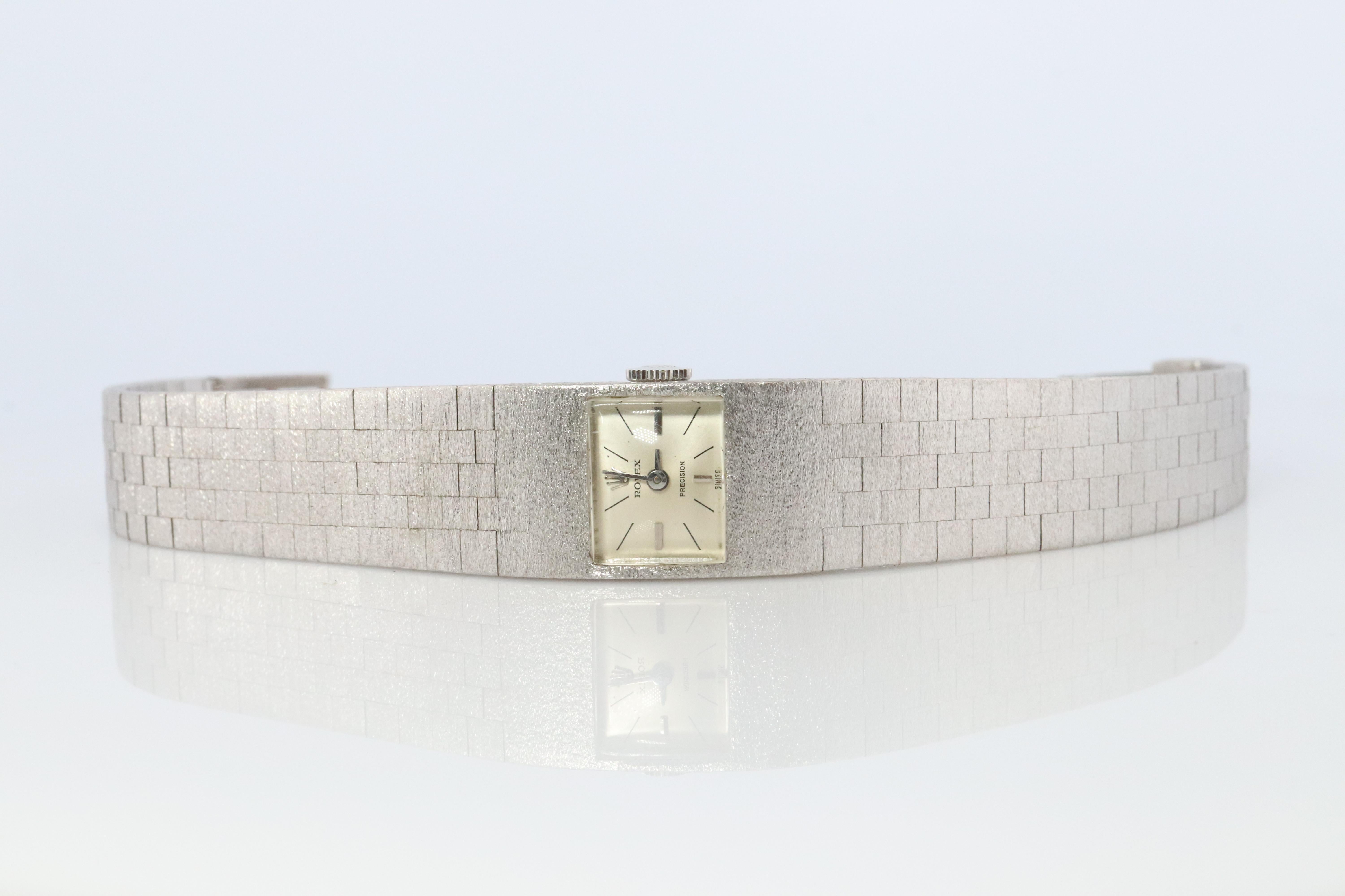 18k White Gold Case Rolex Precision Ladies Watch with attached Milanese Bracelet (10k Gold).

Rolex Windup 1400 Caliber Movement Ref. 2159 TV Screen.

Circa 1970

Case Is 18k White Gold Gold CASE. Bracelet is 10k White Gold!

Beautiful Watch. Manual