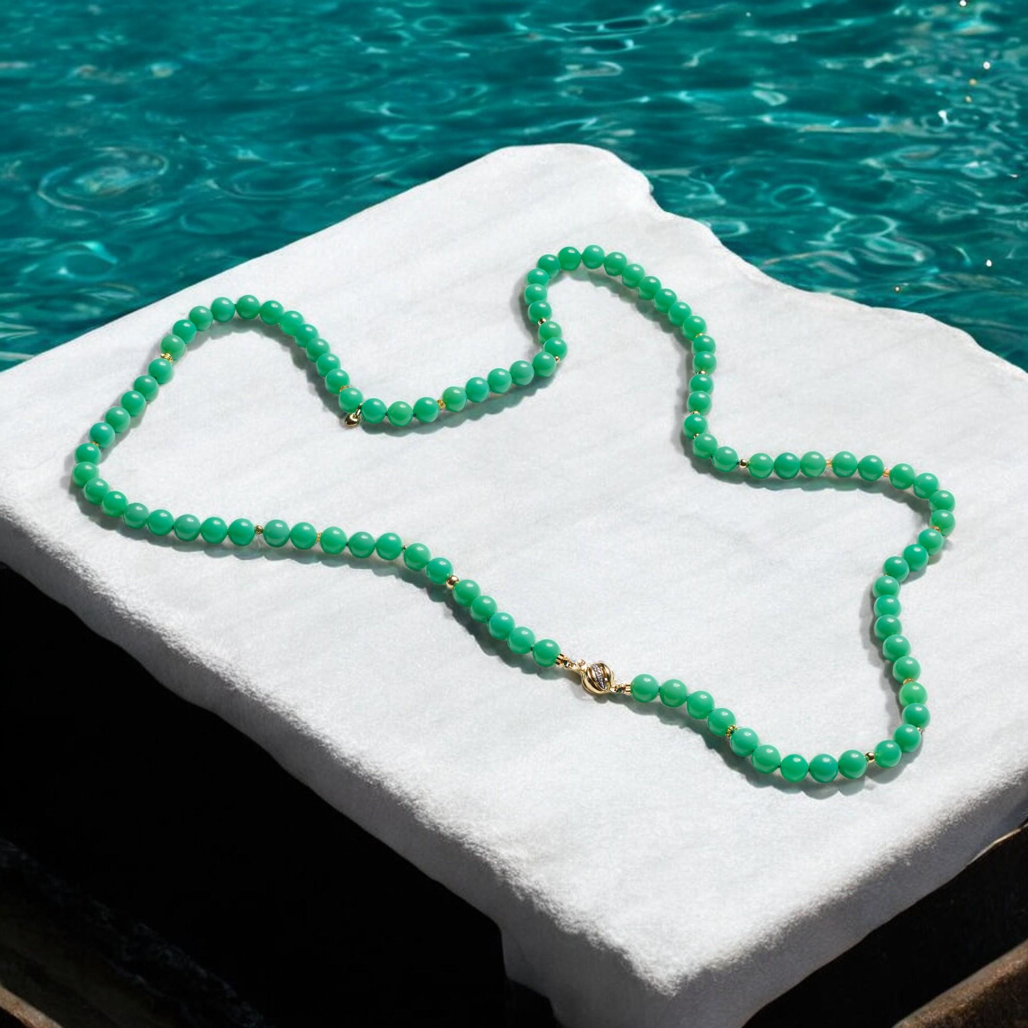 A regal opera length handcrafted necklace with the highest quality flawless Chrysoprase stones. This necklace features genuine high grade green Chrysoprase, delicately strung together with solid 14k gold (heart charm) beads, creating an elegant