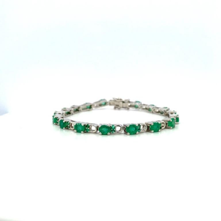 Beautifully handcrafted silver Genuine 7.40 Carat Emerald Tennis Bracelet, designed with love, including handpicked luxury gemstones for each designer piece. Grab the spotlight with this exquisitely crafted piece. Inlaid with natural emerald
