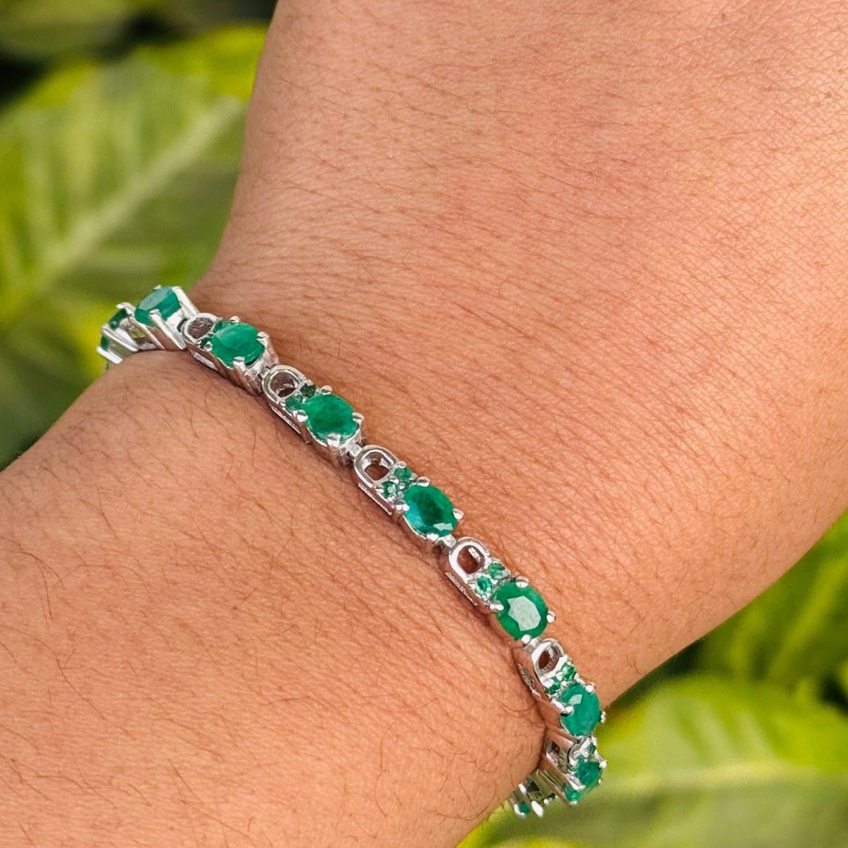 Genuine 7.40 Carat Emerald Tennis Bracelet in sterling silver showcases endlessly sparkling natural emerald, weighing 7.40 carat. It measures 7 inches long in length. 
Emerald stimulate concentration and reduces stress. 
Designed with perfect oval,