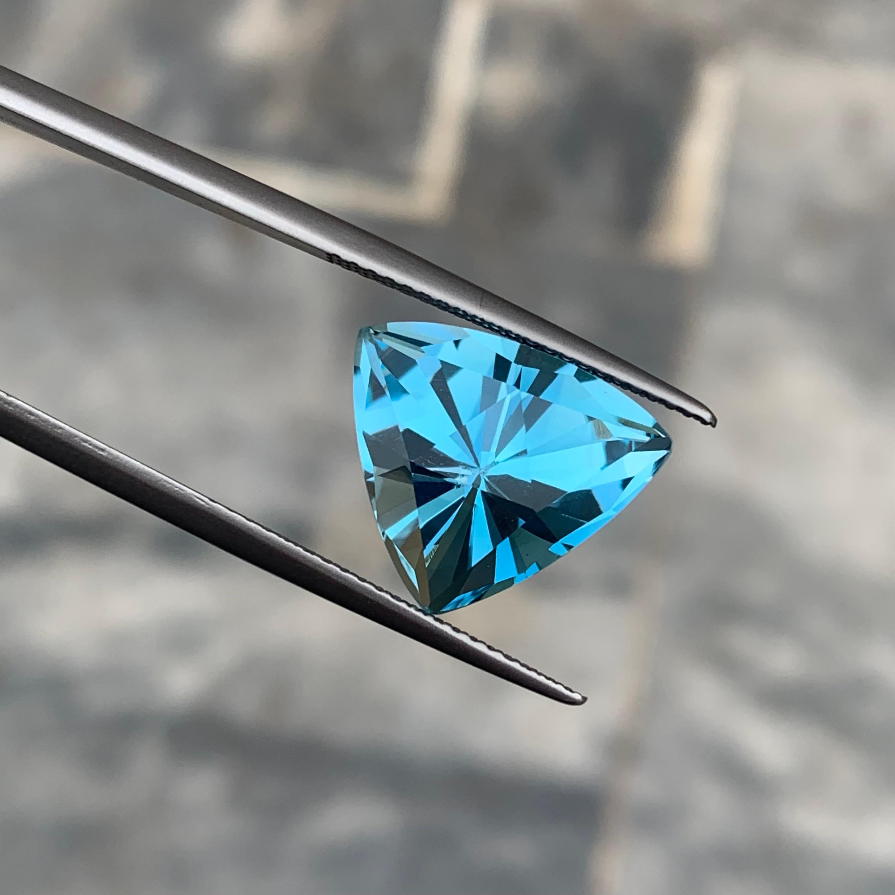 Gemstone Type : Faceted Blue Topaz 
Weight : 9.0 Carats
Dimensions : 12.8x14.4x9.1 Mm
Origin : Brazil
Clarity : Eye Clean
Shape: Trillion
Color: Blue
Certificate: On Demand
Blue Topaz Metaphysical Properties
Blue topaz, in particular, is believed to