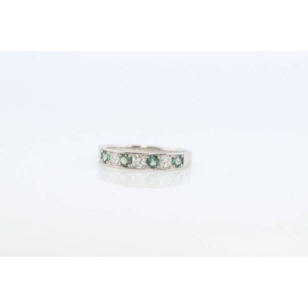 Vintage from the 1990s
Size: 7 1/4 US
Materials: Gold, Platinum
Gemstone: Alexandrite
Gem color: Green

Band Color: White

A beautiful piece.

Genuine Alexandrite rated at AB quality. Changes colors in different light.

900 Platinum

Eternity