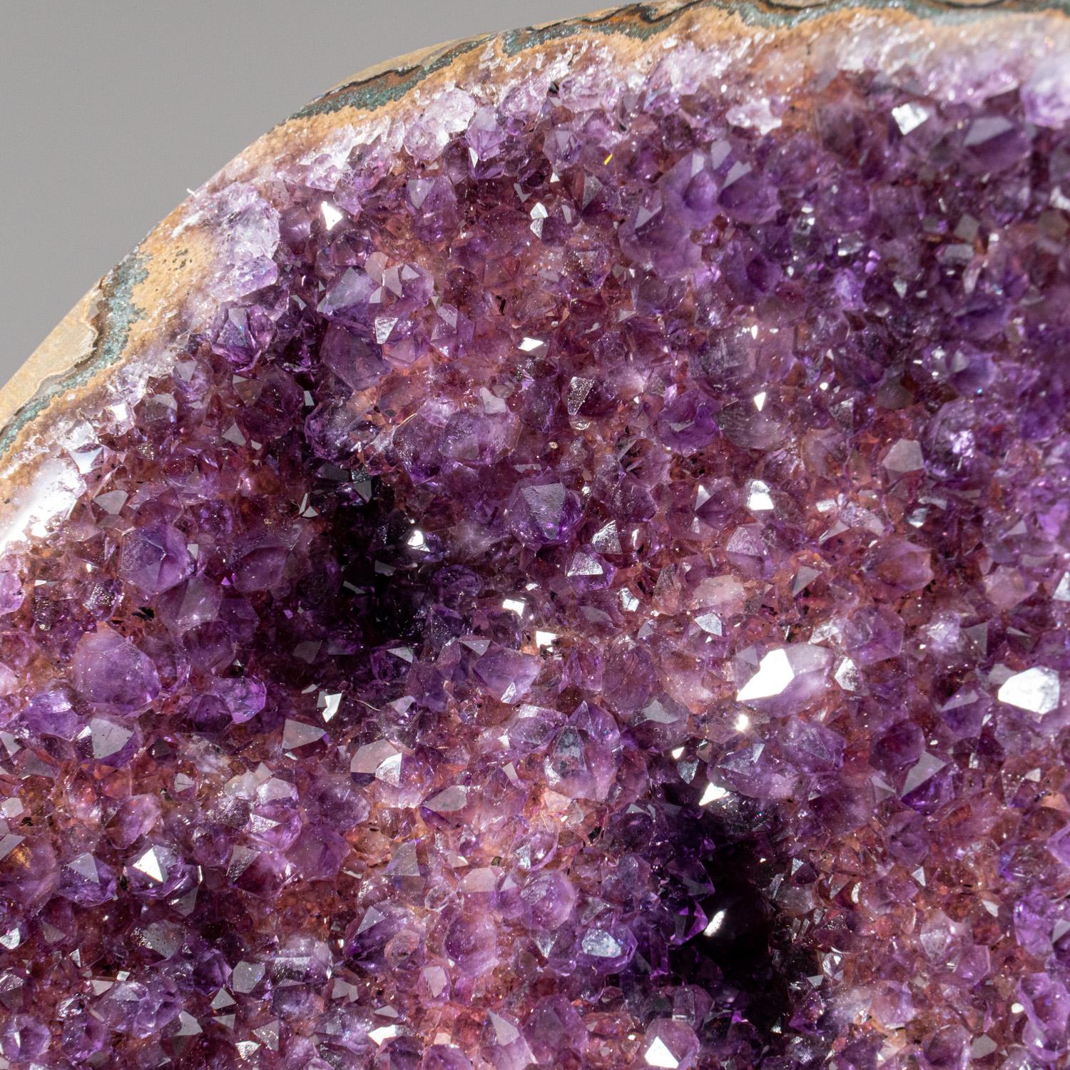 AAA Top Quality natural formation of gem amethyst variety quartz cluster with lustrous fully terminated crystals with highly reflective faces and deep transparent to translucent grape color.
Amethyst is a highly protective and effective crystal