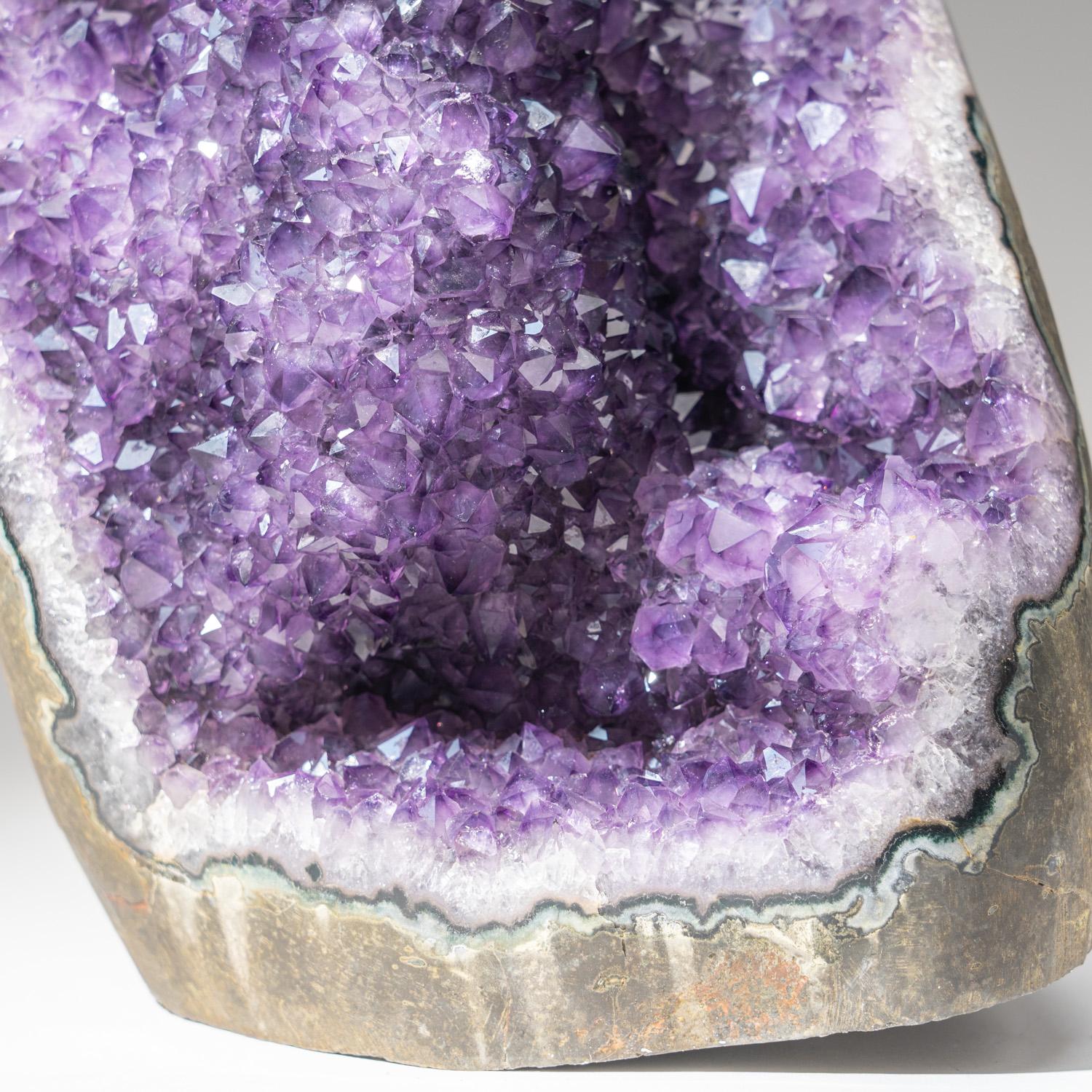 AAA quality natural formation of gem amethyst variety quartz cluster with lustrous fully terminated crystals with highly reflective faces and deep transparent to translucent grape color.
Amethyst is a highly protective and effective crystal known to