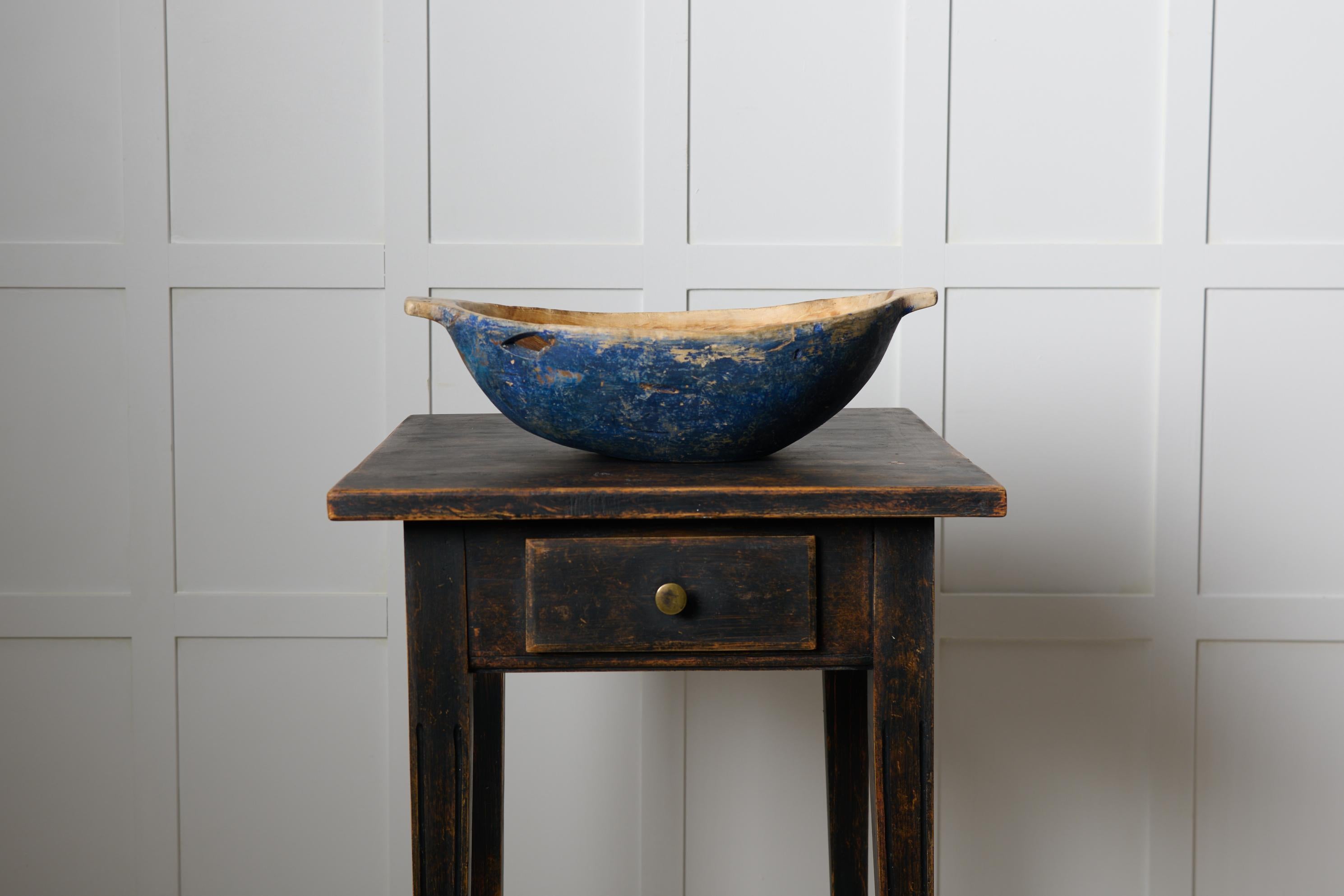 Genuine antique wooden bowl from Sweden made by hand around 1840 to 1850. Oval shape in original condition with natural distress and patina after 200 years of use. There is a smaller hole in the side which has been there from the beginning – most