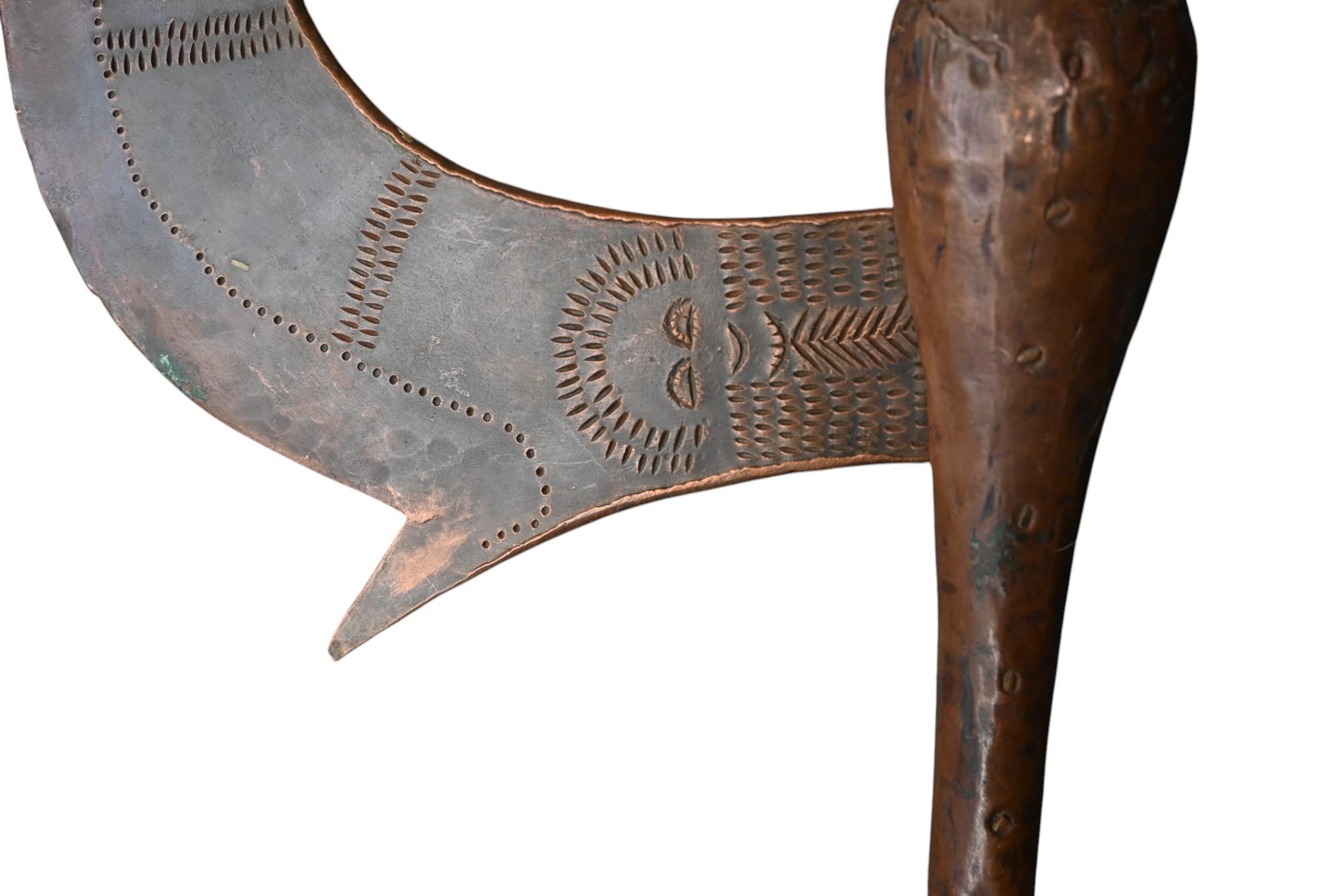 A genuine ax from the Songye tribe DR Congo, copper around wooden handle and with a heavy copper blade.
The axes with a copper blade are much more rare then those from iron
Hammered decorations on each side of the blade 
Uncleaned, aged