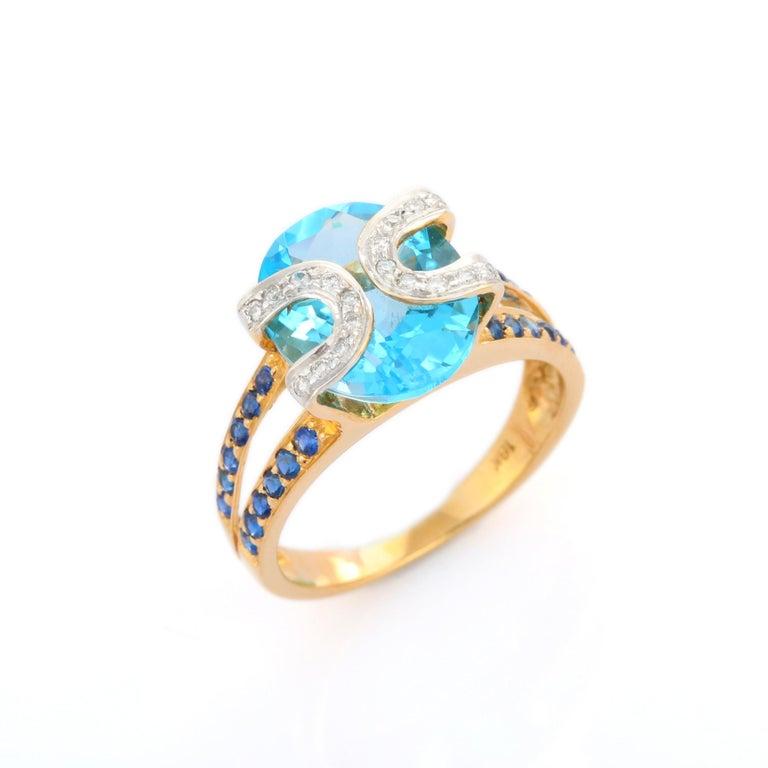 For Sale:  Genuine Blue Topaz Cocktail Ring with Sapphire and Diamonds in 18k Yellow Gold 7